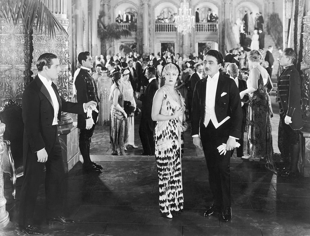 Gloria Swanson acts surprised at a formal party from the movie "My Own Party" | Photo: Getty Images