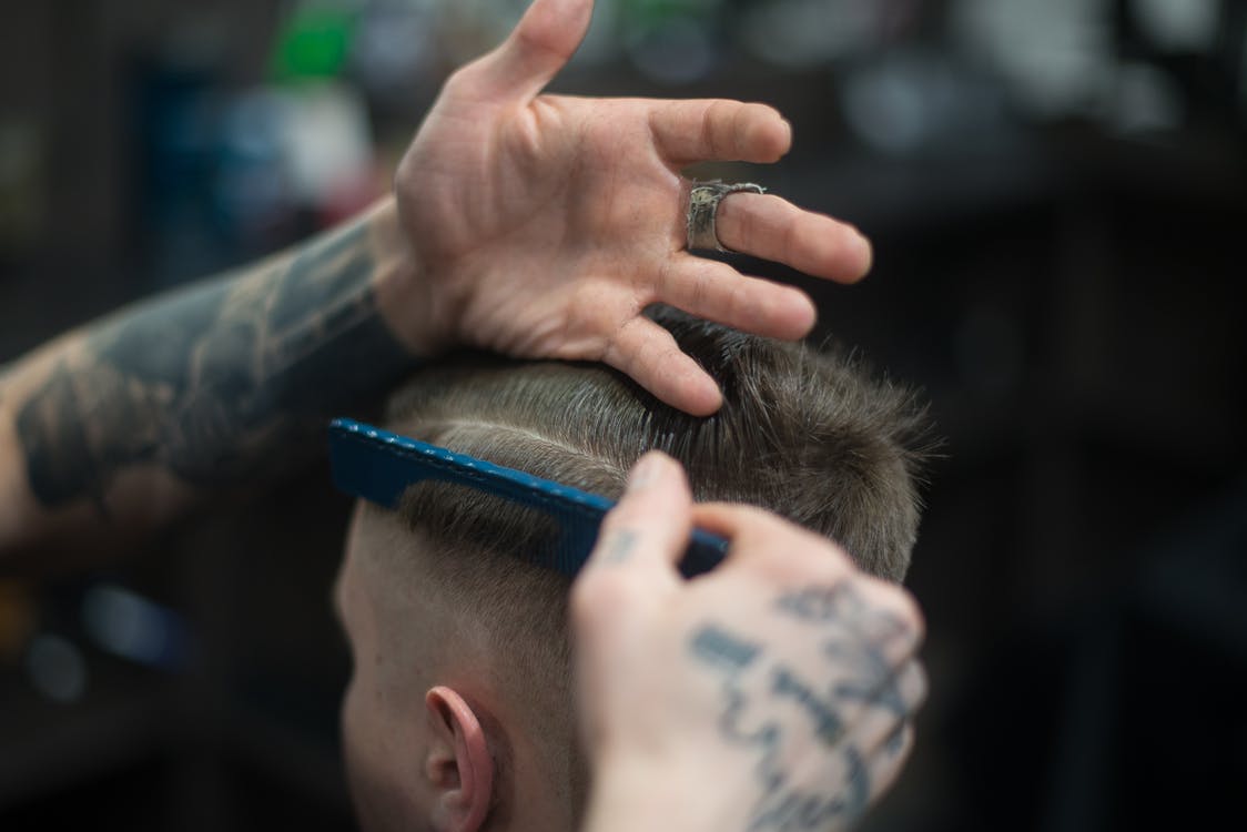 A photo of a man at the barbershop. | Photo: Pexels