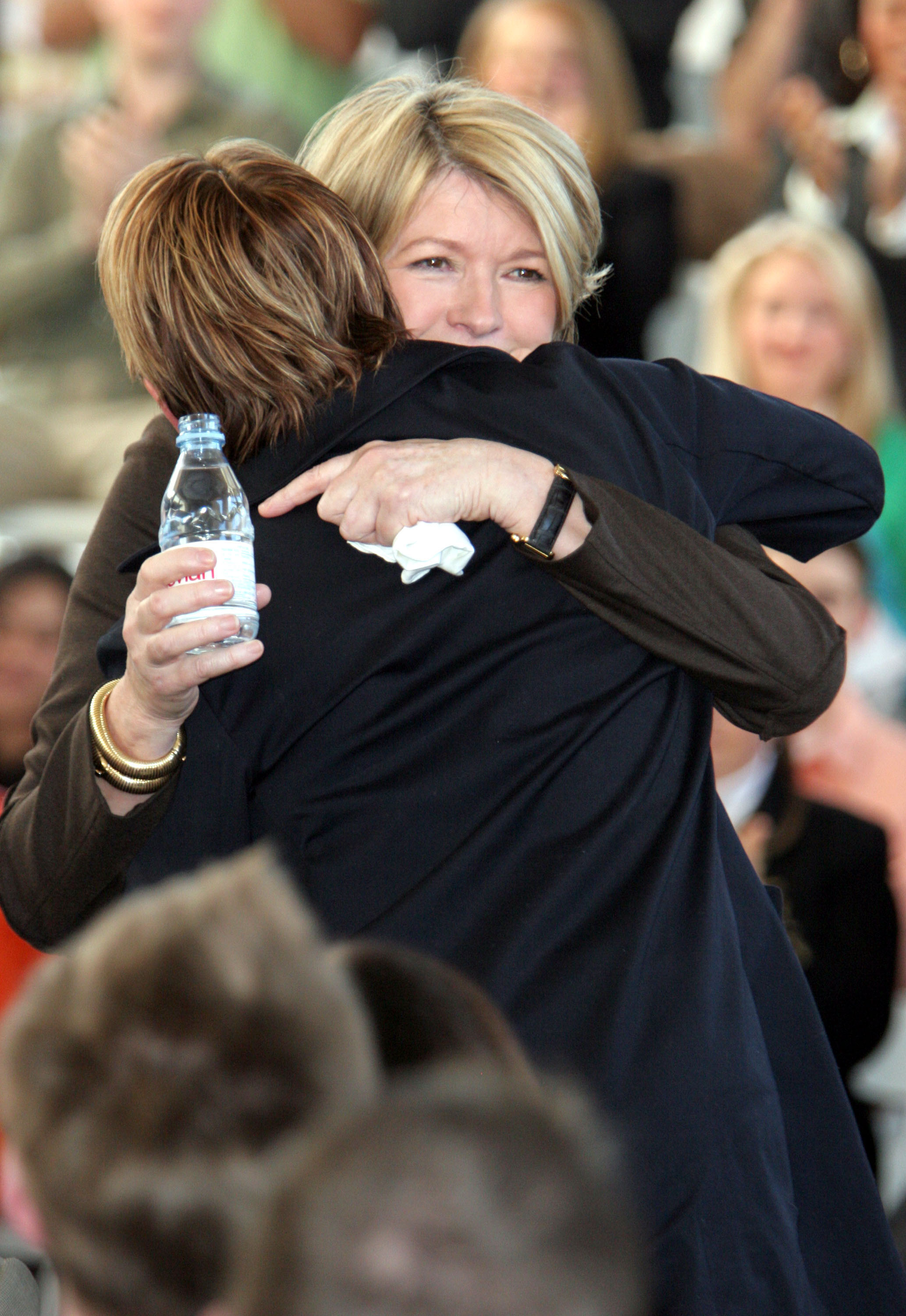 Alexis Stewart hugs her mother Martha Stewart during a press conference at Omnimedia Headquarters on March 7,2005, in New York City. | Source: Getty Images