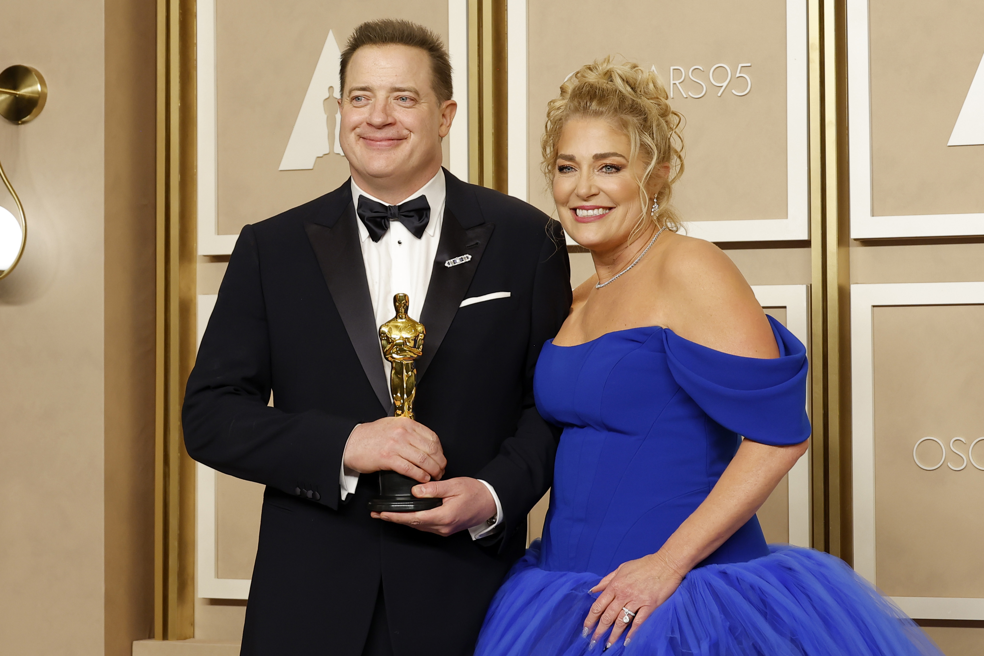 Brendan Fraser and Jeanne Moore pose in the press room during the 95th Annual Academy Awards on March 12, 2023, in Hollywood, California | Source: Getty Images
