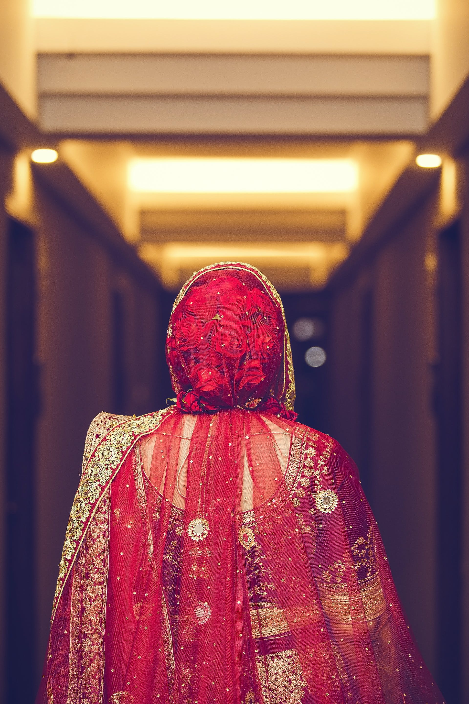 An bride in a red traditional dress | Source: Pexels