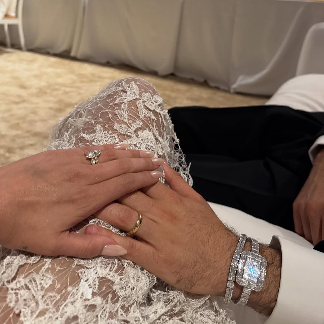 Selena Gomez and Benny Blanco holding hands while showing their wedding rings, from a post dated September 28, 2025 | Source: Instagram/itsbennyblanco