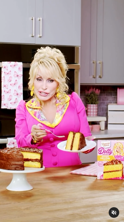 Dolly Parton dazzles in a vibrant pink and yellow ensemble in a video shared on Instagram. | Source: Instagram/dollyparton