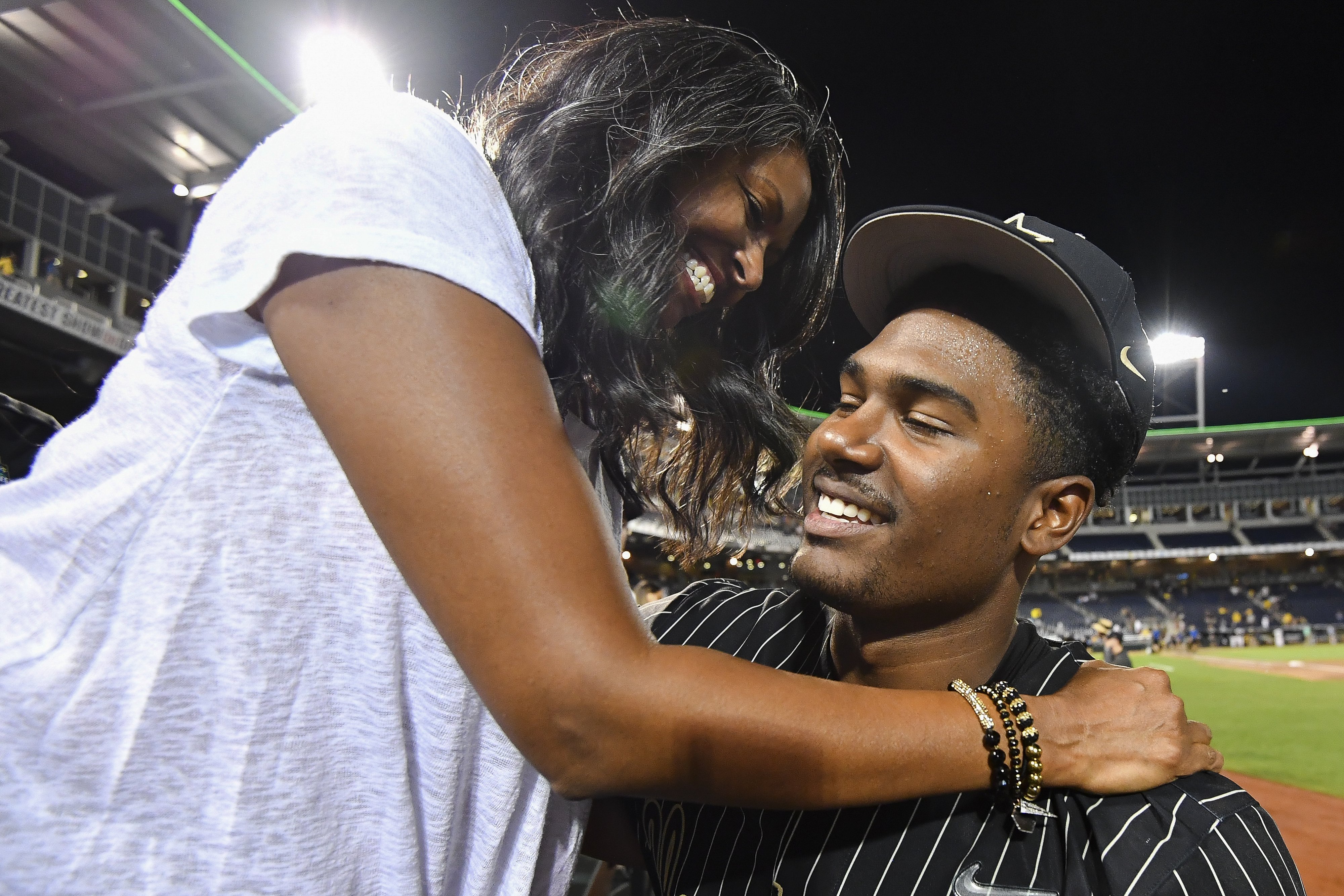 Kumar Rocker is hugged by his mother, Lalitha, after the Commodores defeated the Michigan Wolverines during the Division I Men's Baseball Championship on June 25, 2019 in Omaha, Nebraska. | Source: Getty Images