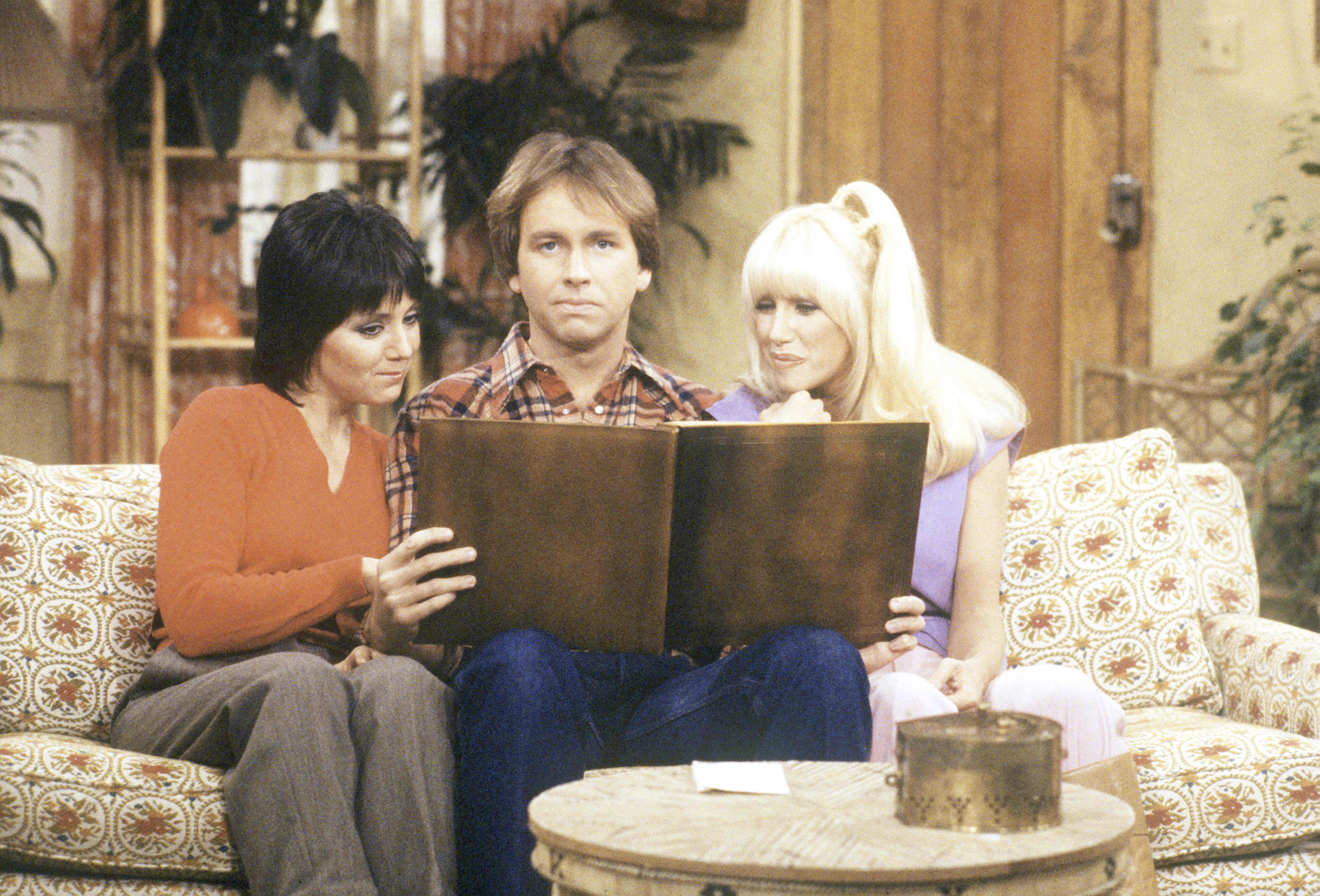 Jack (John Ritter), Chrissy (Suzanne Somers on the right), and Janet (Joyce DeWitt) in the episode titled "Lee Ain't Heavy, He's My Brother" from Season Four of "Three's Company," which aired on February 26, 1980 | Source: Getty Images