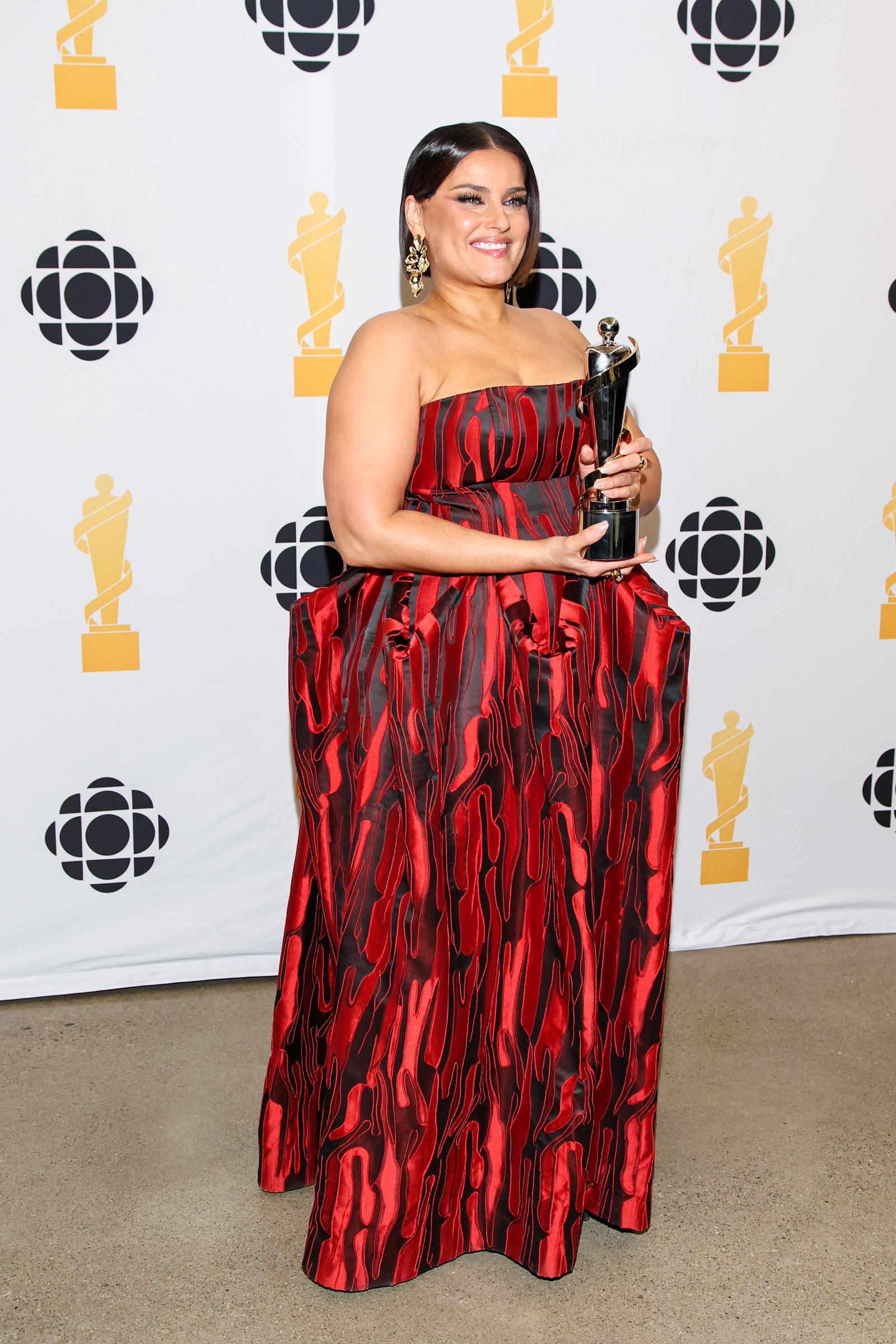 Nelly Furtado beams at the JUNO Awards in Hamilton, Ontario, proudly holding her award as she celebrates her induction into the Canadian Music Hall of Fame.