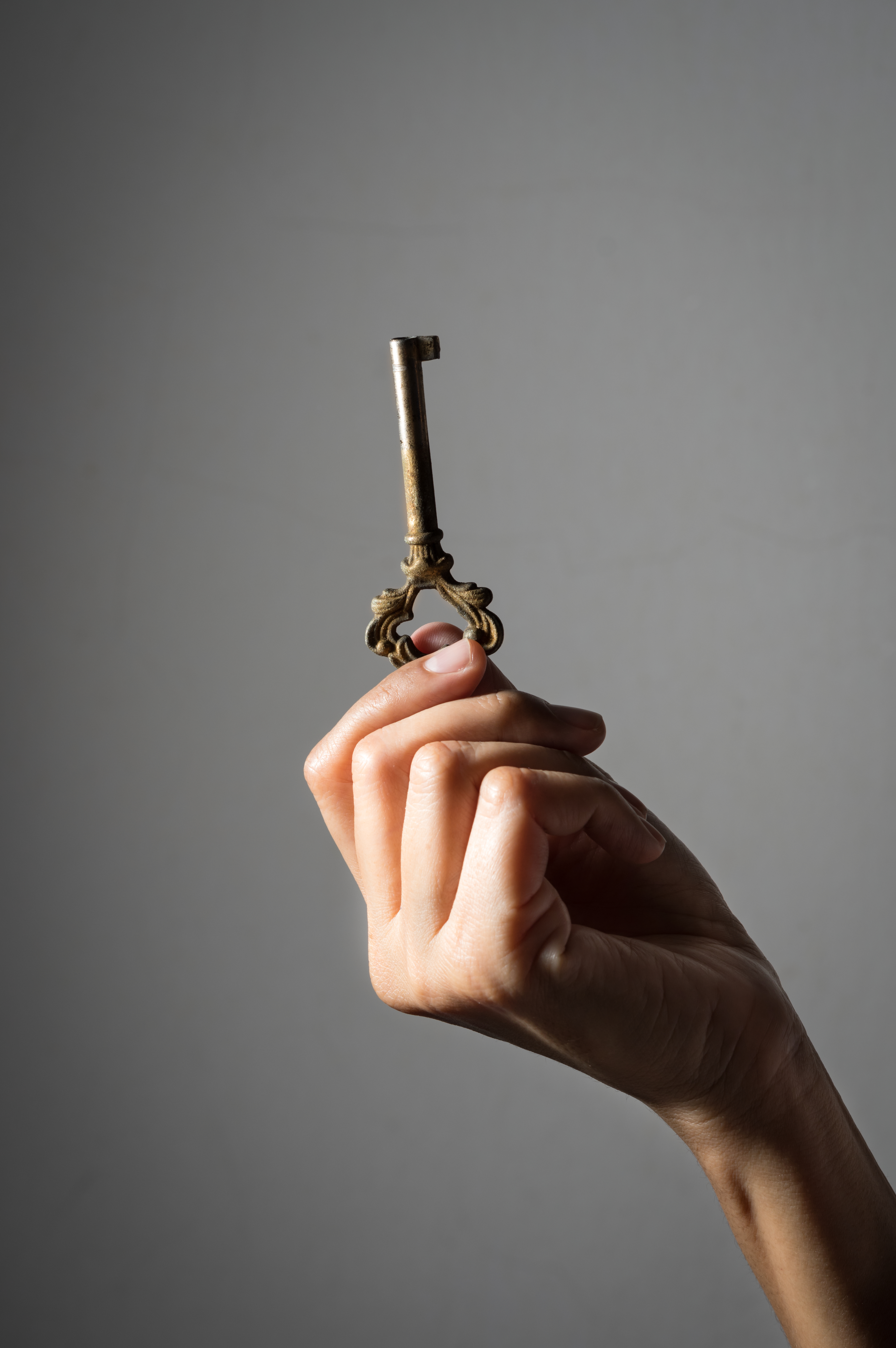 Old key in woman hand | Source: Shutterstock