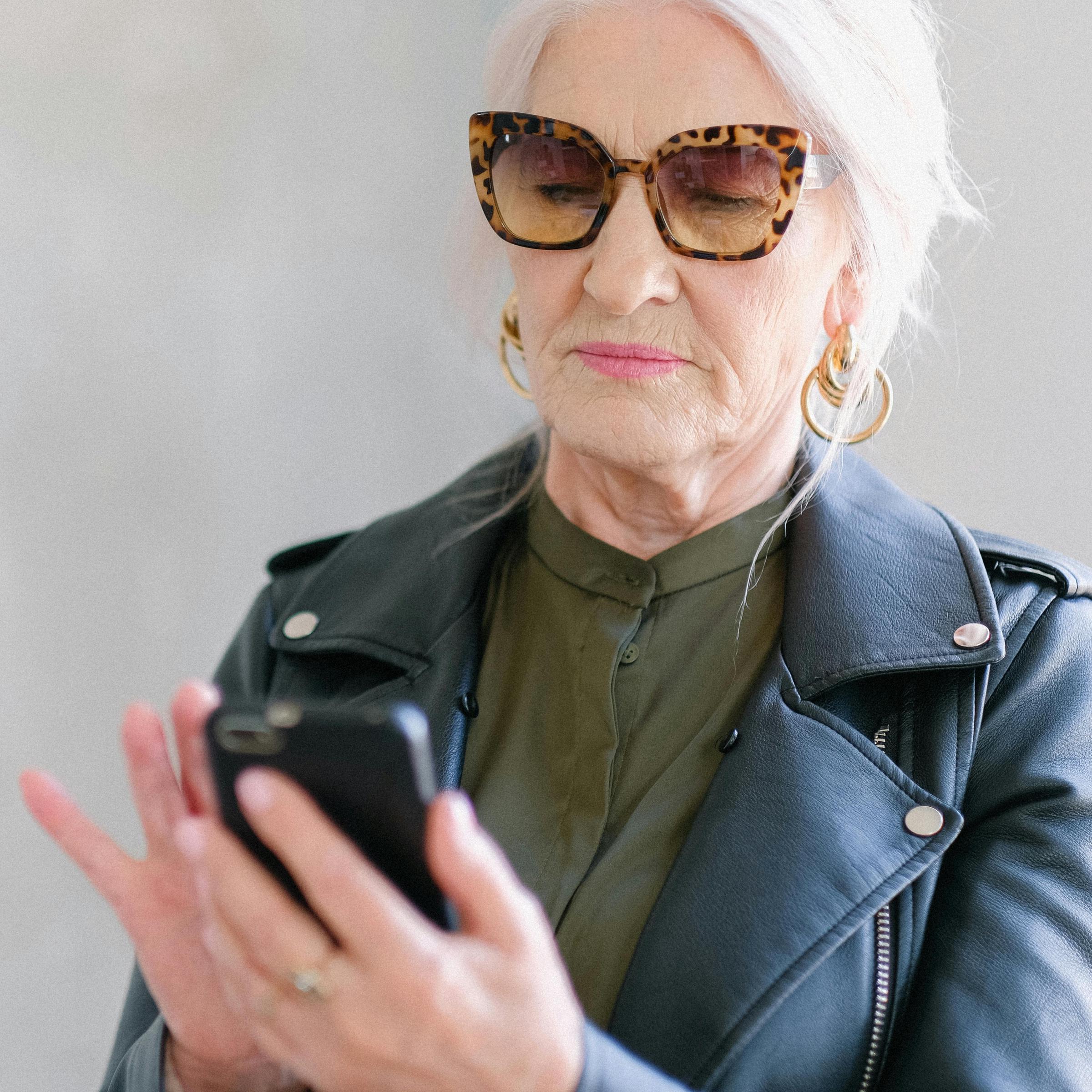 An elderly woman placing a mobile phone call | Source: Midjourney