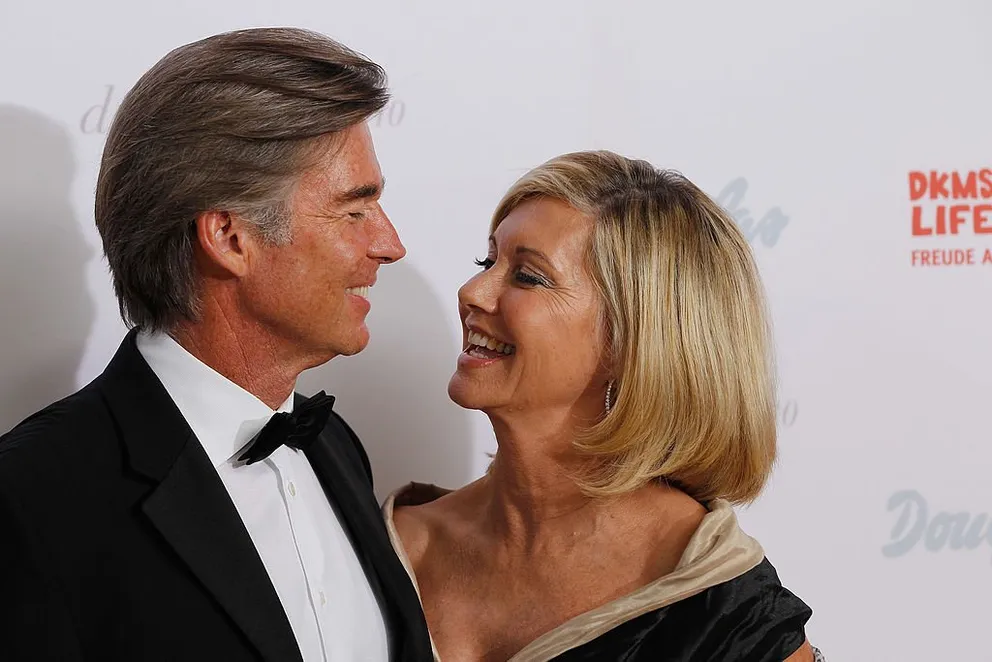 Olivia Newton-John with her husband, John Easterling, pictured at the Dreamball 2010 charity gala at the Grand Hyatt hotel, Berlin, Germany. | Photo: Getty Images