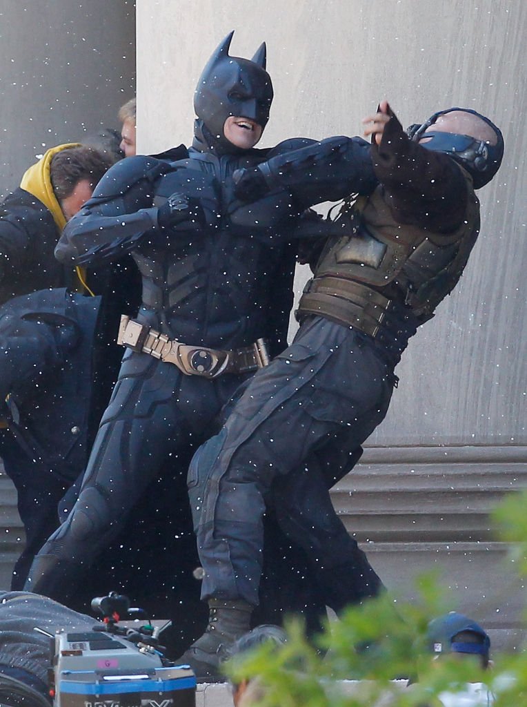 Christian Bale, playing Batman, acts in a scene with Tom Hardy, playing Bane, during the filming of the new Batman: Dark Knight Rises movie at the Mellon Institute building in the Oakland neighborhood of Pittsburgh on July 31, 2011. | Source: Getty Images
