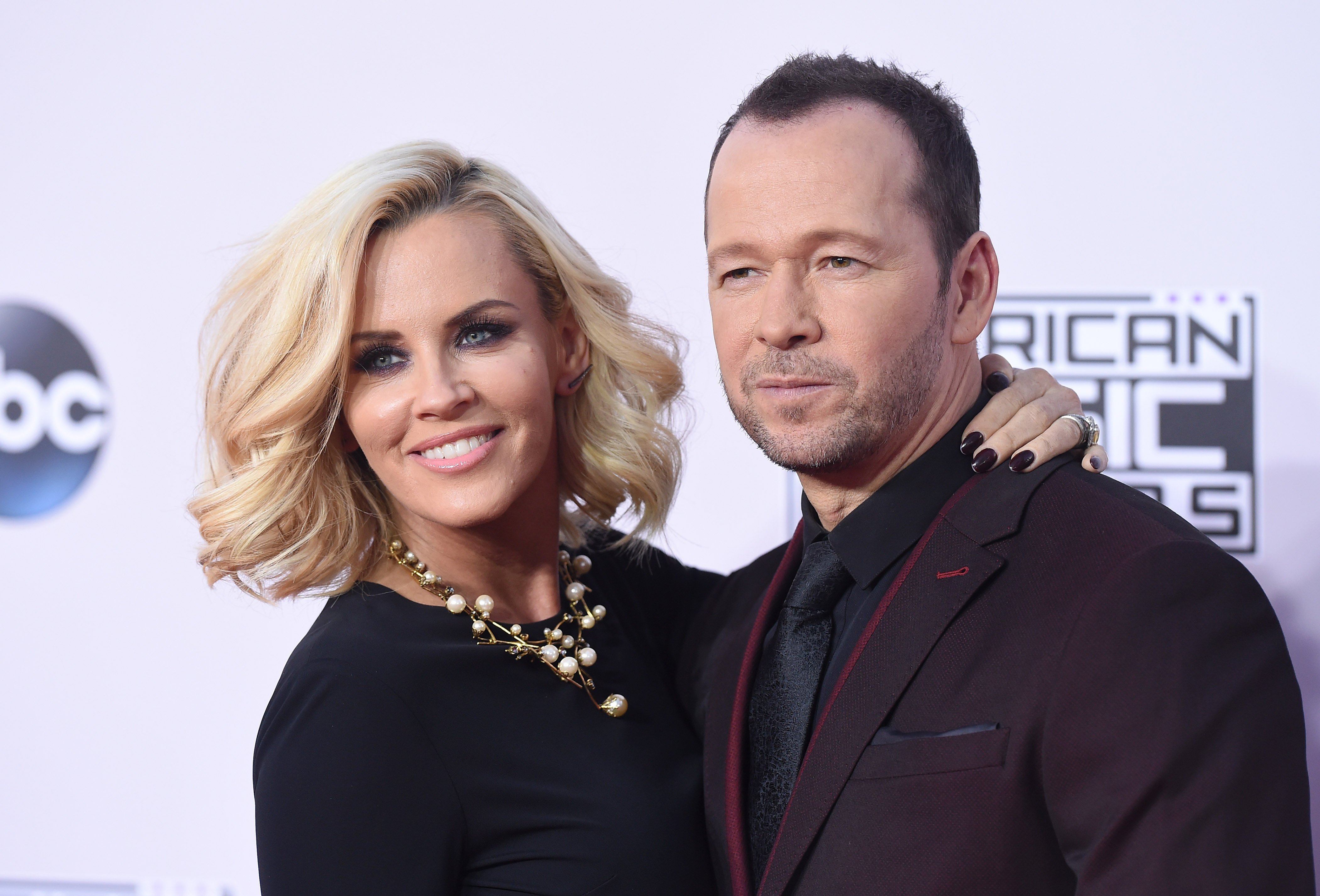 Jenny McCarthy and actor/singer Donnie Wahlberg arrive at the 2014 American Music Awards at Nokia Theatre L.A. Live on November 23, 2014 in Los Angeles, California | Source: Getty Images