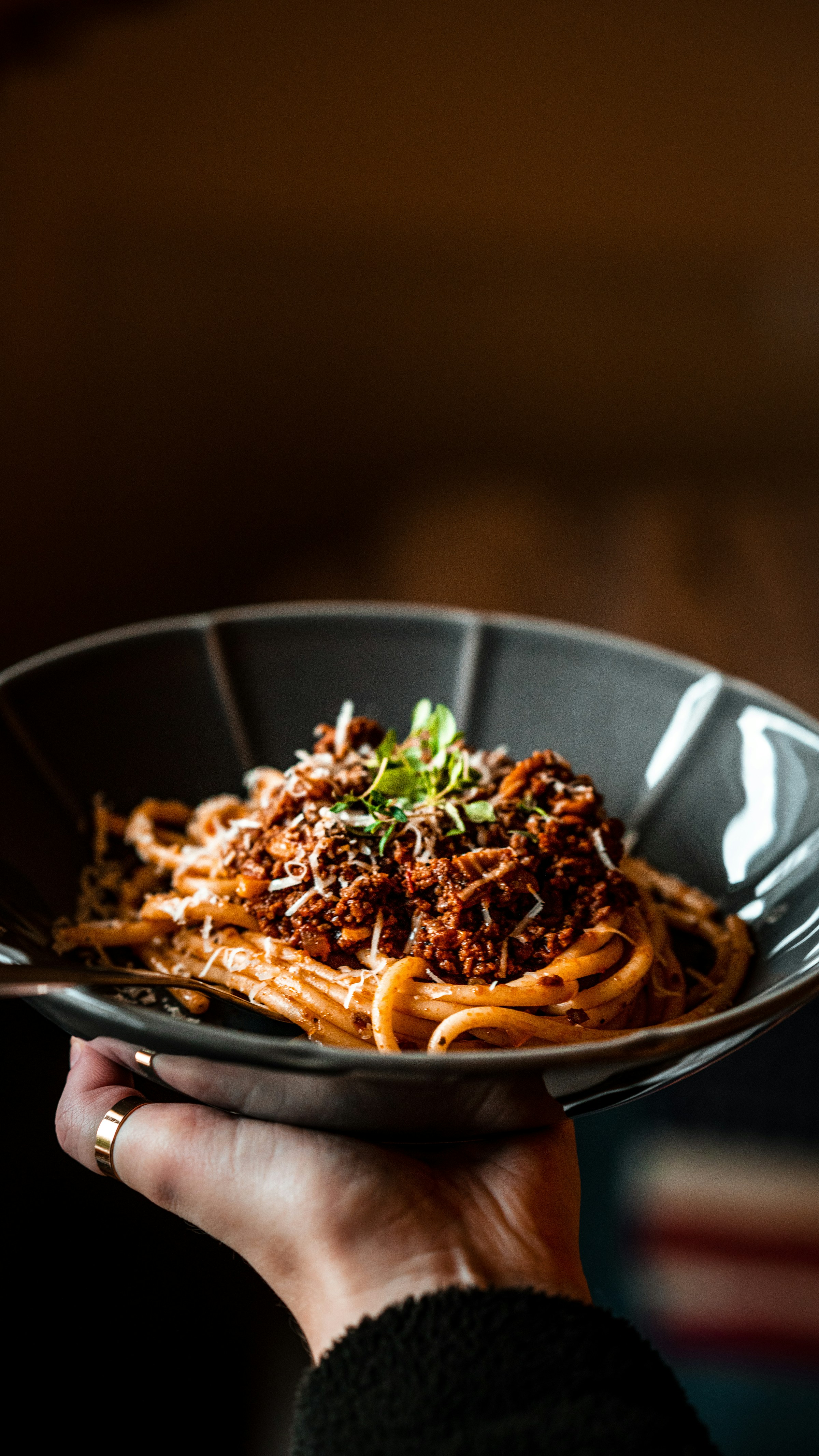 A person holding a bowl of pasta | Source: Unsplash
