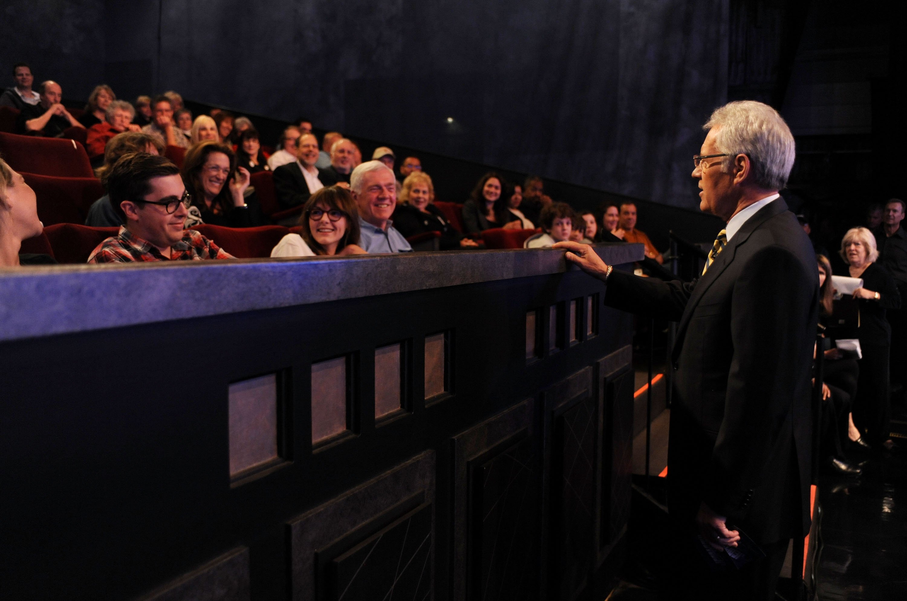 Game show host Alex Trebek (R) interacts with the audience on the set of the "Jeopardy!" Million Dollar Celebrity Invitational Tournament Show Taping on April 17, 2010| Photo: Getty Images