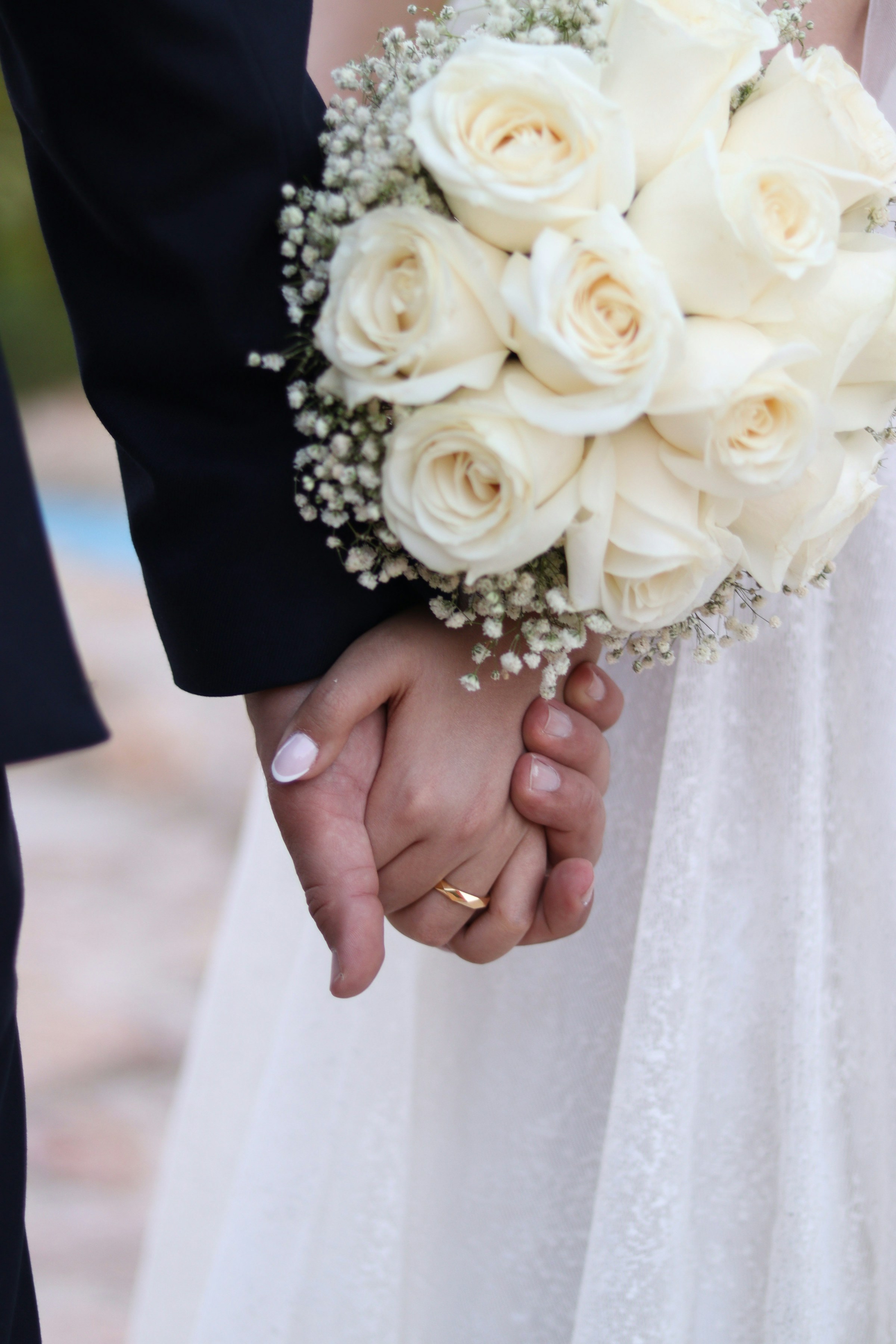 A bride and groom holding hands | Source: Unsplash