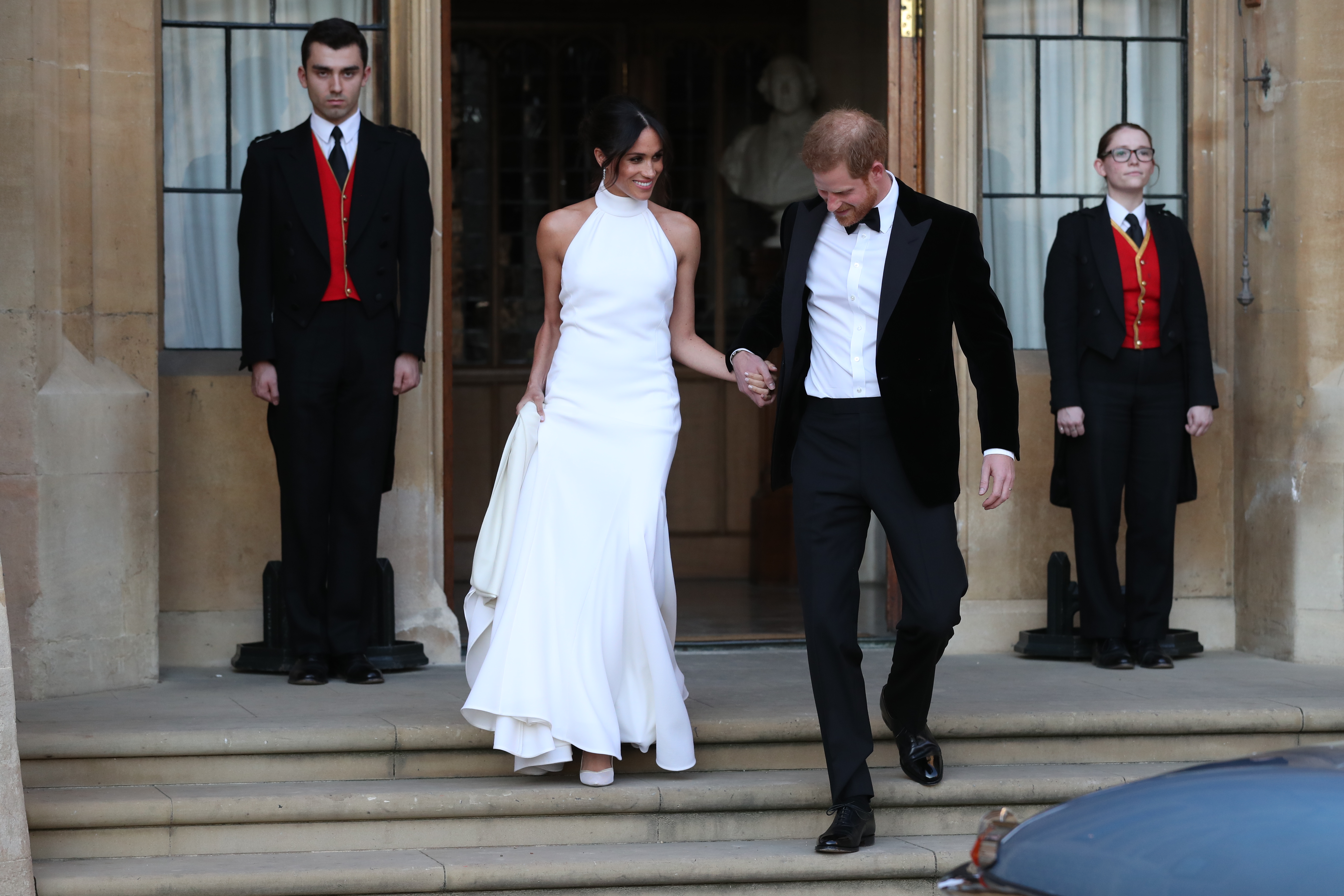 Meghan Markle and Prince Harry leave Windsor Castle for an evening reception at Frogmore House in Windsor, England, on May 19, 2018. | Source: Getty Images
