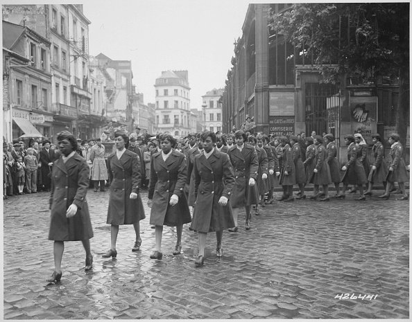 Members of the 6888th Central Postal Directory Battalion take part in a parade ceremony in honor of Joan d'Arc at the marketplace where she was burned at the stake in 1945. | Photo: GettyImages
