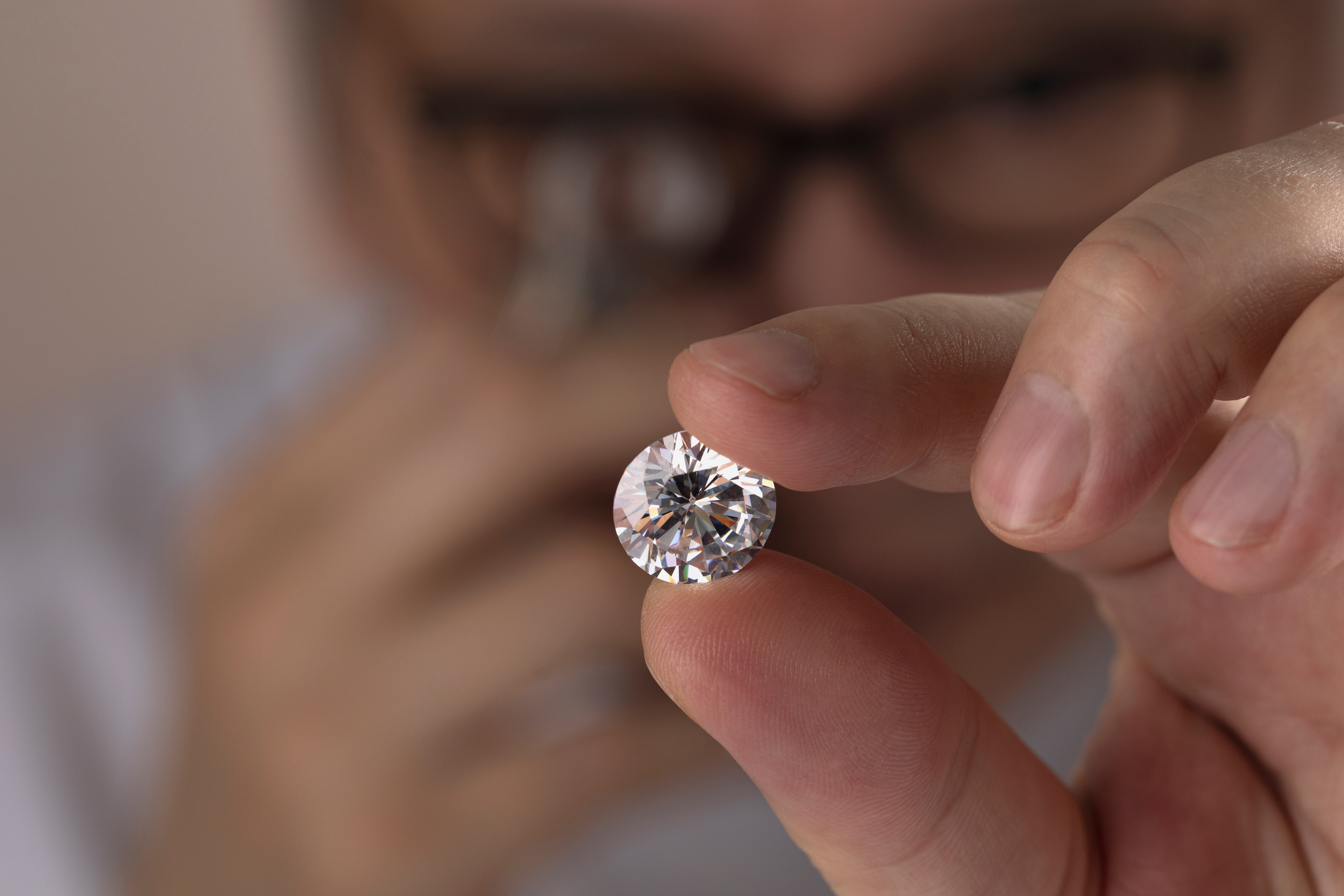 Man in glasses is looking at diamond | Source: Shutterstock.com