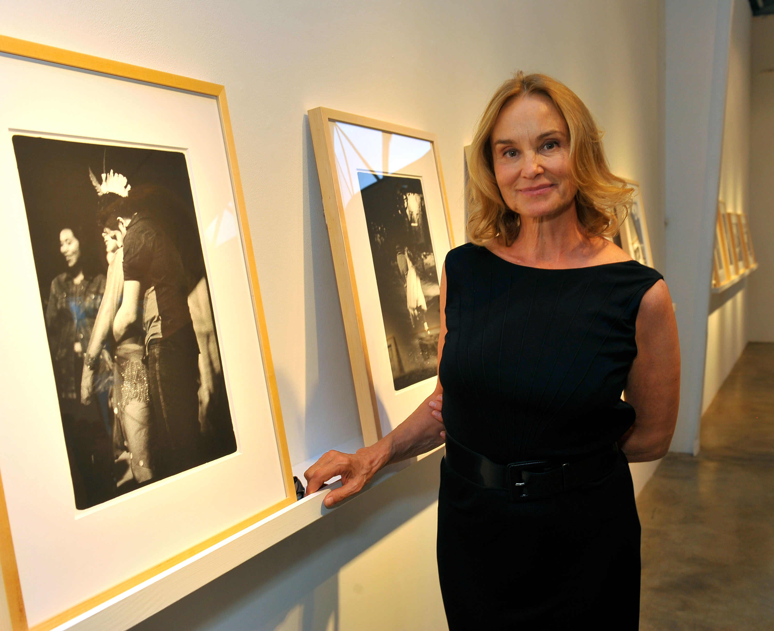 Jessica Lange poses with her photographs during the reception of 'Jessica Lange: 50 Photographs 1992-2008' at The Rose Gallery on July 18, 2009 in Santa Monica, California | Source: Getty Images