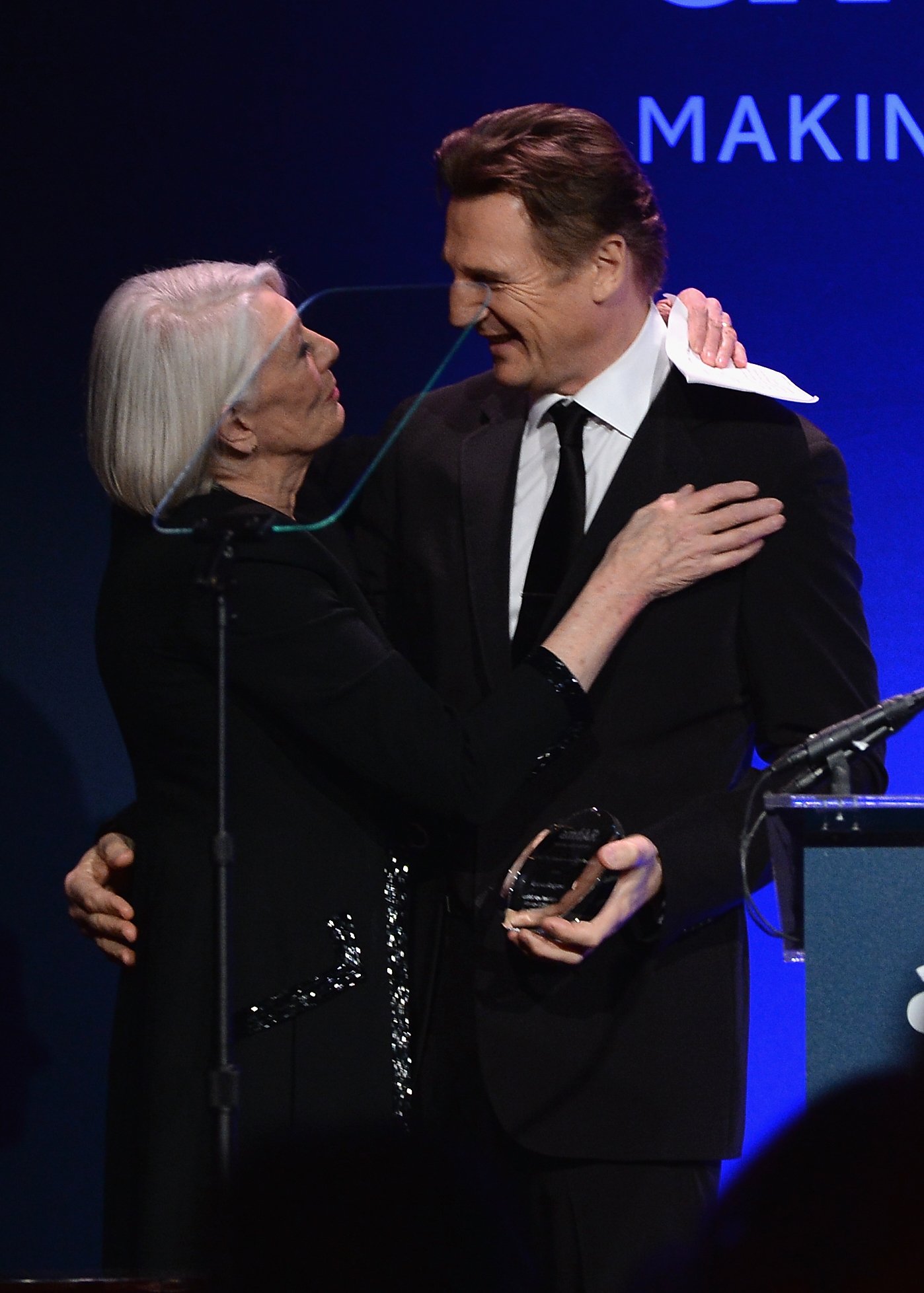 Vanessa Redgrave and Liam Neeson onstage during the 2014 amfAR New York Gala at Cipriani Wall Street on February 5, 2014 in New York City | Source: Getty Images 