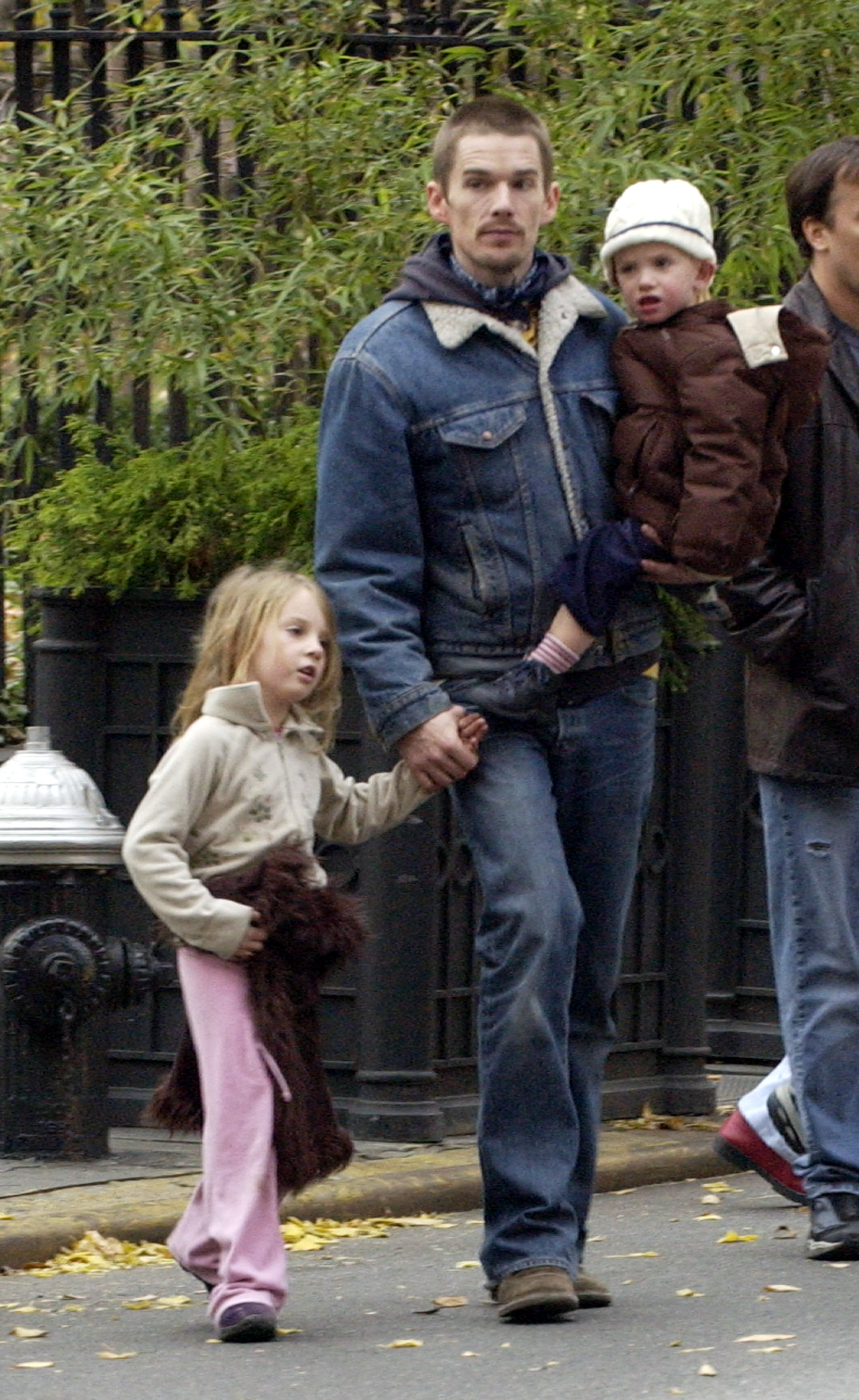Tiny hand in her father's, young Maya Hawke was already exuding grace during a Thanksgiving stroll through Gramercy Park. On 27 November 2003, she walked beside Ethan while he carried her younger sibling, Levon. With the city bathed in autumn light, Maya's calm presence hinted at the poise she would one day bring to every spotlight.