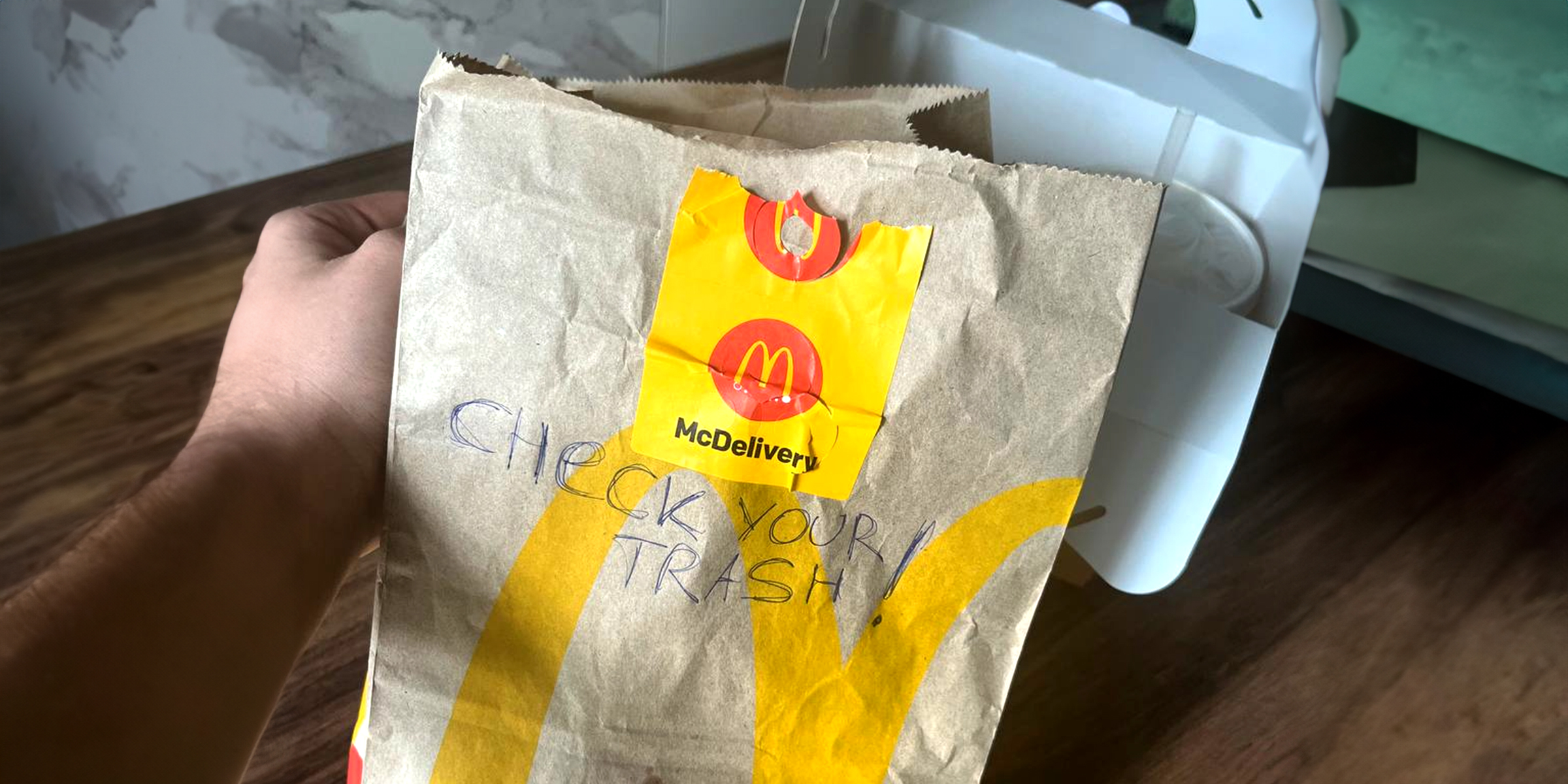 An empty fast-food bag inscribed with a warning | Source: Amomama