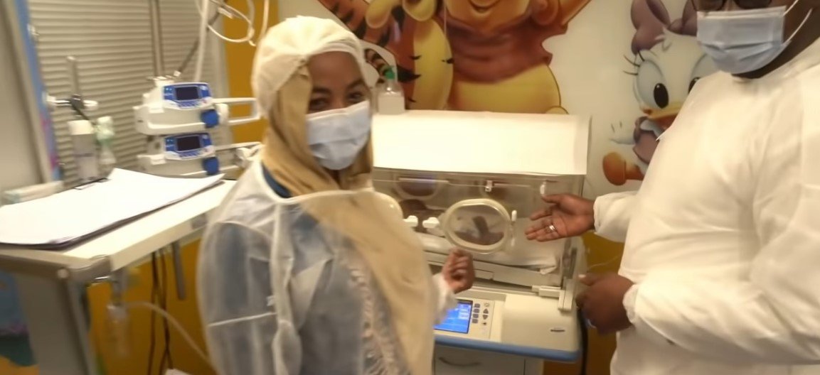 Picture of the parents, Abdelkader Arby and Halima Cisse pointing at one of the babies in the incubator | Source: Youtube/ ABC News 
