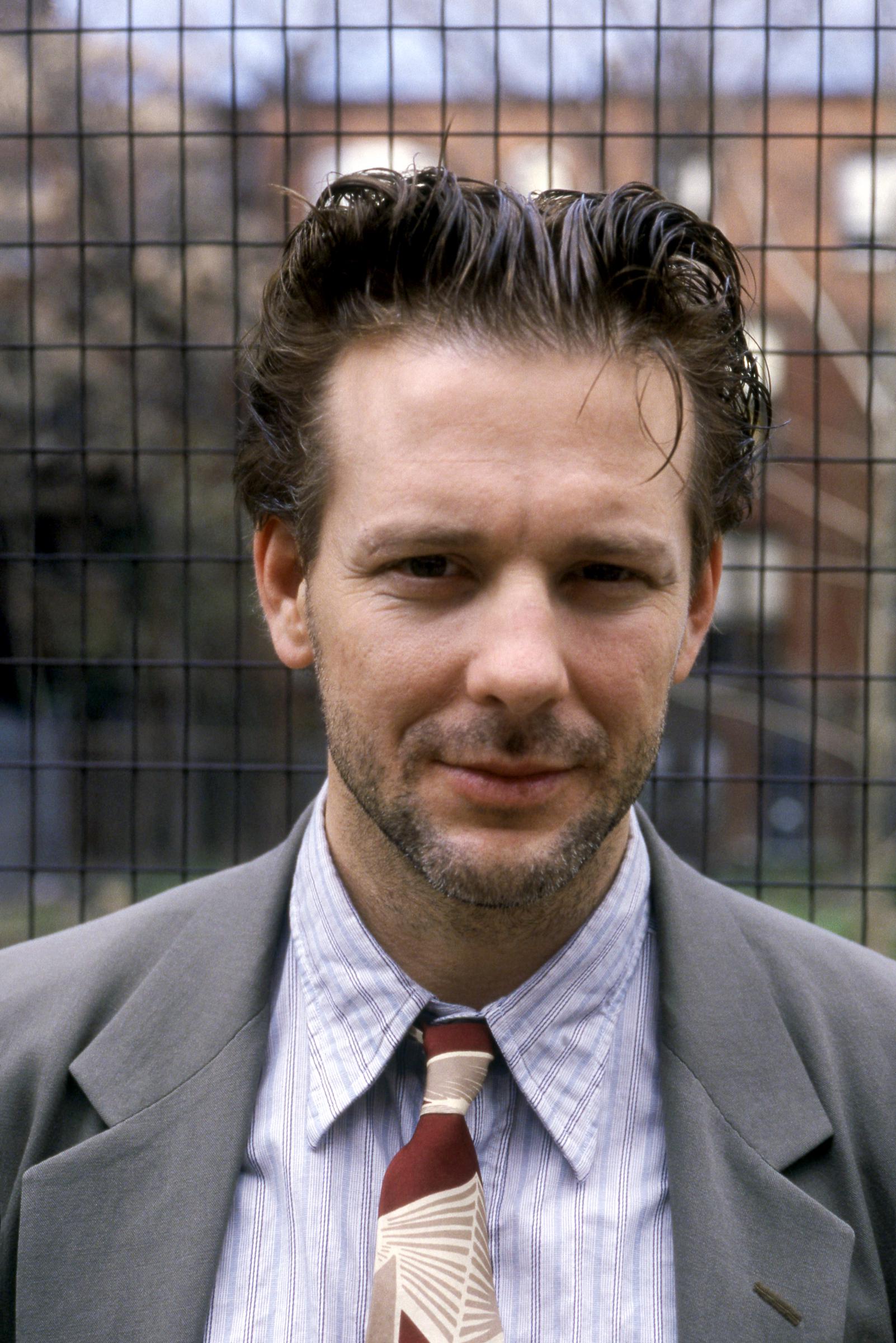 Circa 1980, as his Hollywood career was beginning to gather momentum, Mickey Rourke posed for a portrait in New York with his dark hair swept back and light stubble framing his face. Dressed in a gray jacket, striped shirt, and patterned tie, the young actor offered a glimpse of the look that would soon help make him one of the decade's leading men.