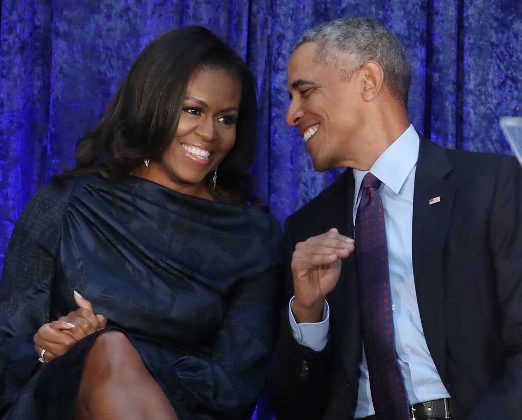 Former U.S. President Barack Obama and first lady Michelle Obama participate in the unveiling of their official portraits during a ceremony at the Smithsonian's National Portrait Gallery in Washington, DC | Photo: Getty Images