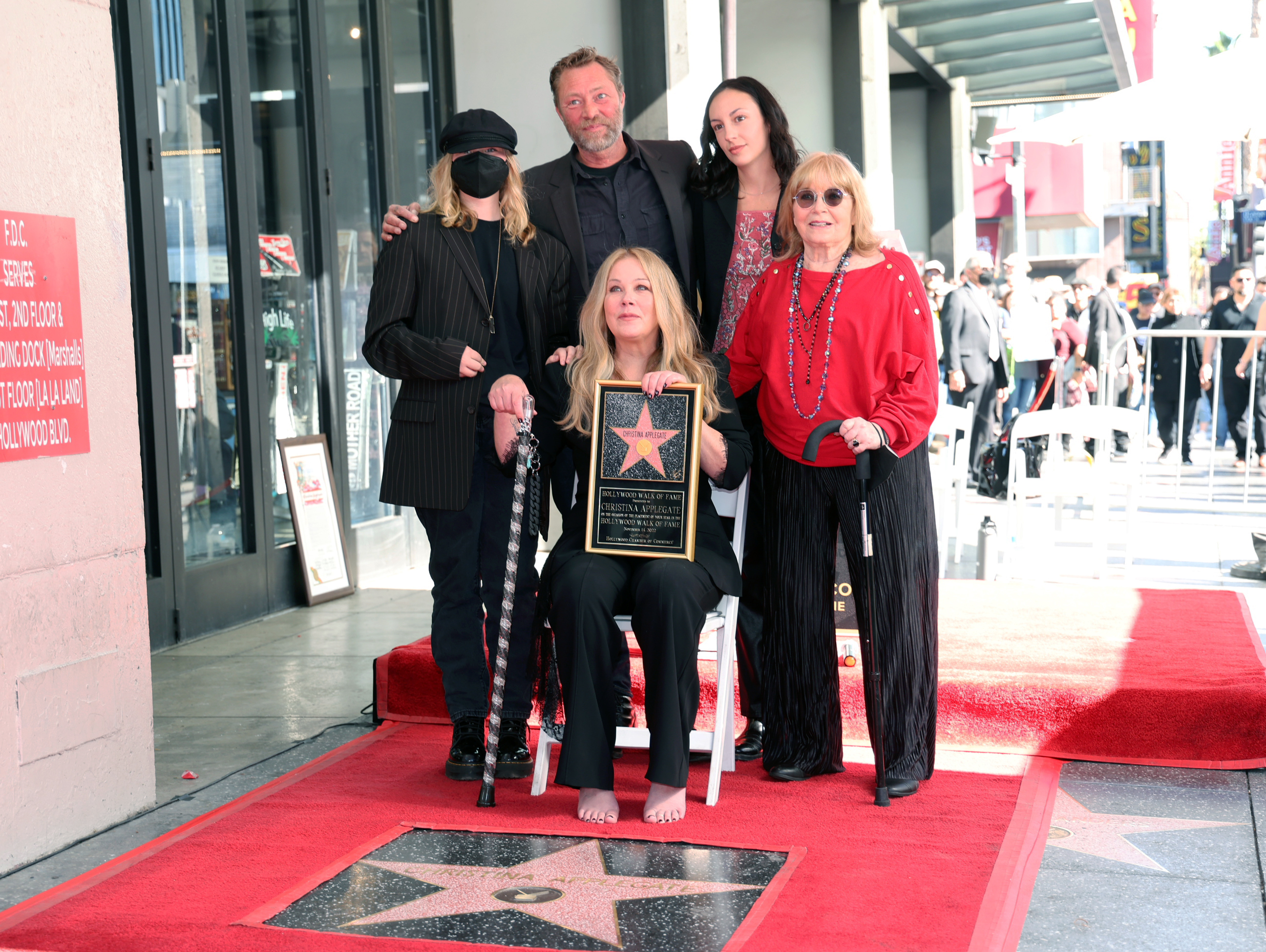 Sadie Grace LeNoble, Martyn LeNoble, Christina Applegate, guest, and Nancy Priddy pose with Christina Applegate's star during the Hollywood Walk of Fame Ceremony in Los Angeles, California, on November 14, 2022. | Source: Getty Images