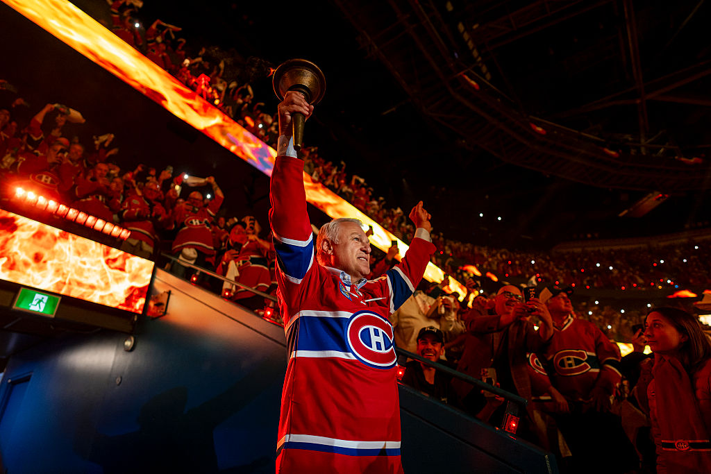 Claude Lemieux carries the torch in the opening ceremony of Game Three of the Eastern Conference Final of the Stanley Cup Playoffs between the Montreal Canadiens and the Carolina Hurricanes on May 25, 2026 in Montreal, Quebec, Canada | Source: Getty Images