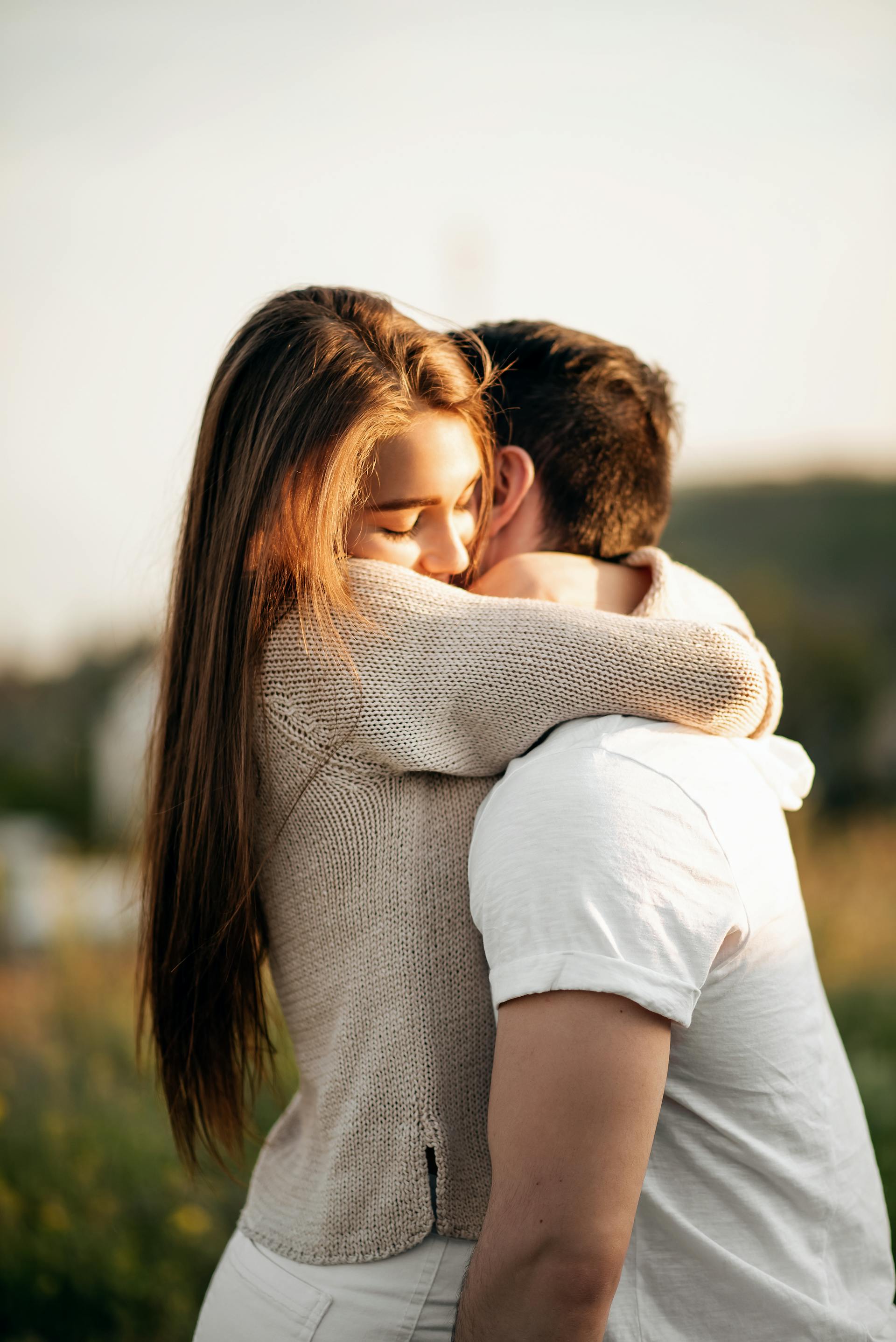 A loving couple embrace outdoors | Source: Pexels