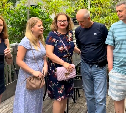 Olena Perez standing with her mom and other loved ones, posted in June 2025. | Source: TikTok/@olena.perez