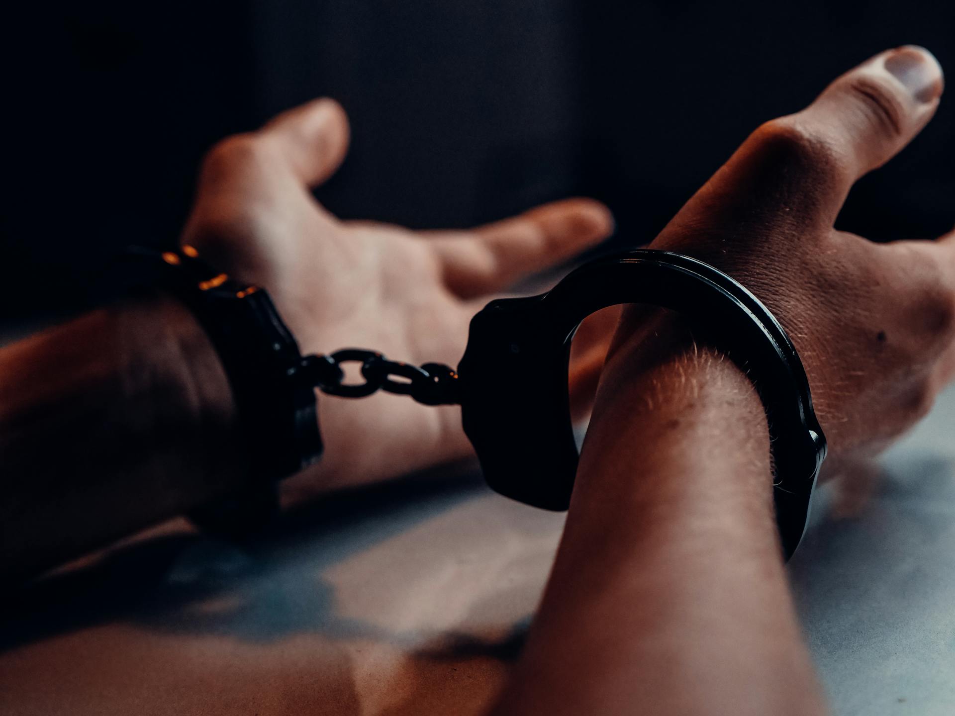 Close-up shot of a man wearing handcuffs | Source: Pexels