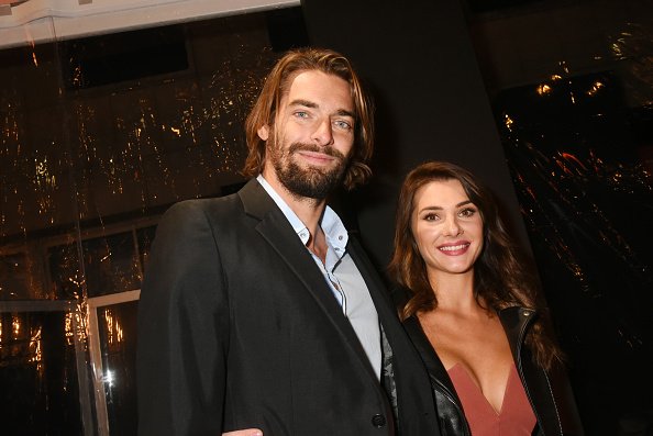 Camille Lacourt et Alice Detollenaere assistent à la soirée de réouverture du flagship "Breitling 1884". |Photo : Getty Images