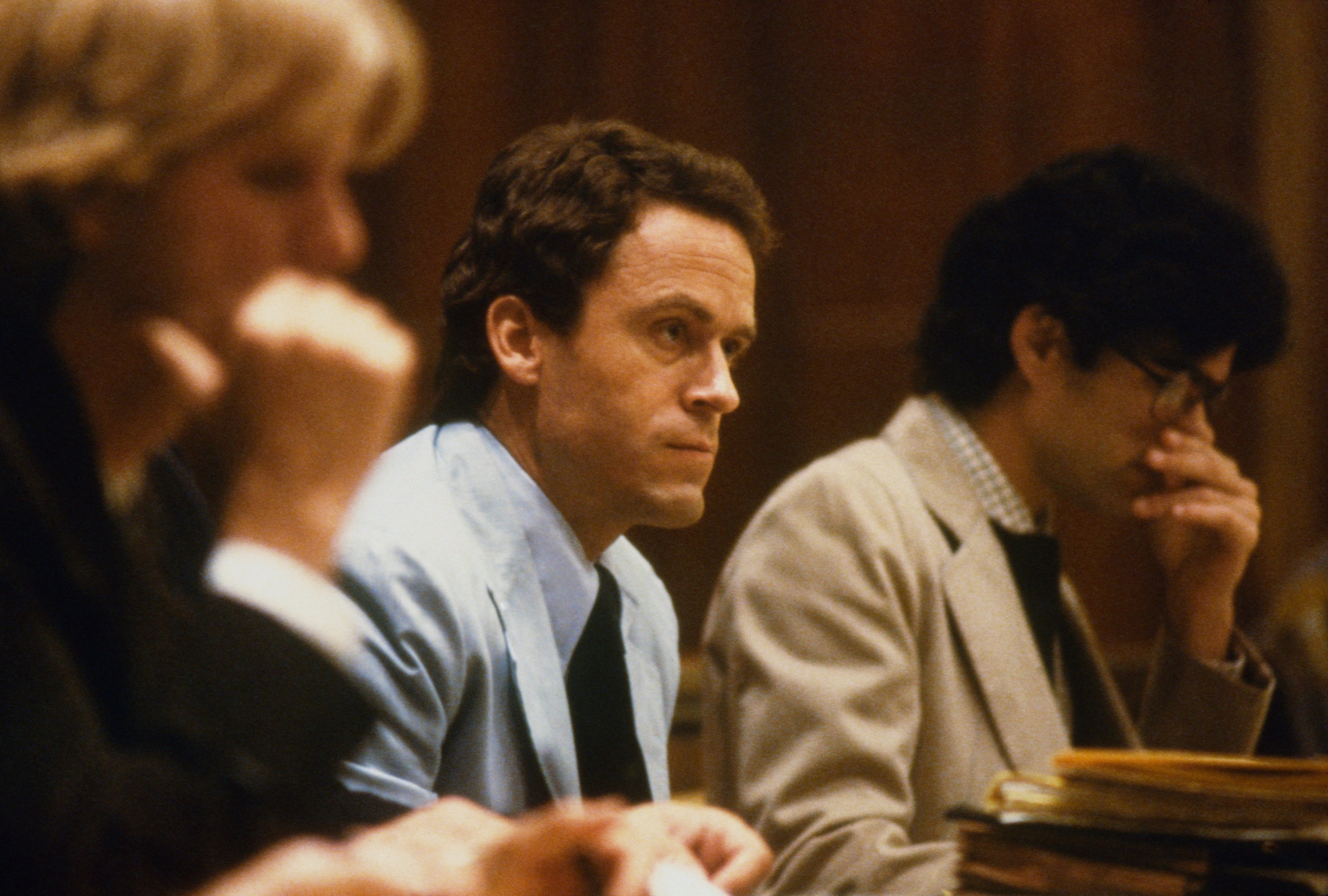Theodore Bundy, seated in court, charged with the killings of two FSU coeds.| Source: Getty Images