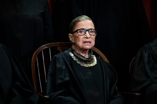 Justice Ruth Bader Ginsburg poses with other Justices of the United States Supreme Court during their official group photo at the Supreme Court | Photo:Getty Images