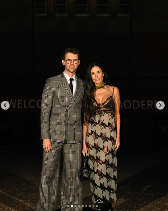 Brad Goreski and Demi Moore smile at the camera during the Gucci Cruise 2025 Fashion Show, dated May 2024. | Source: Instagram/demimoore