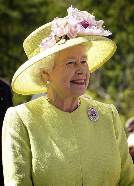 Her Majesty the Queen of the United Kingdom smiling away from the camera during a visit in NASA’s Goddard Space Flight Center, Maryland, USA. | Source: WikiMedia Commons Her Majesty the Queen of the United Kingdom smiling away from the camera during a visit in NASA’s Goddard Space Flight Center, Maryland, USA. | Source: WikiMedia Commons