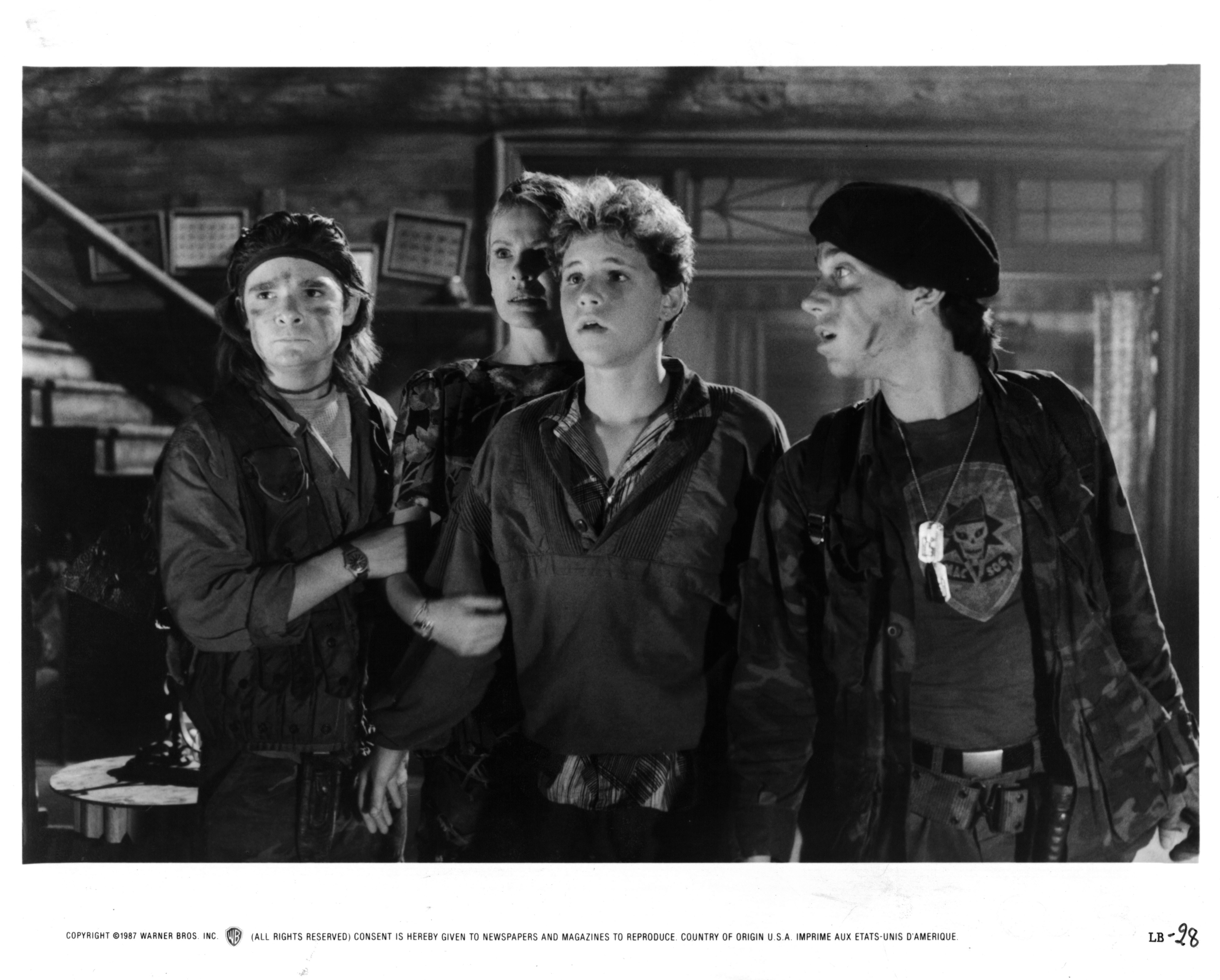 (L-R) Corey Feldman, Dianne Wiest, Corey Haim, and Jamison Newlander are pictured in a scene from the film, 'The Lost Boys', in 1987 | Source: Getty Images