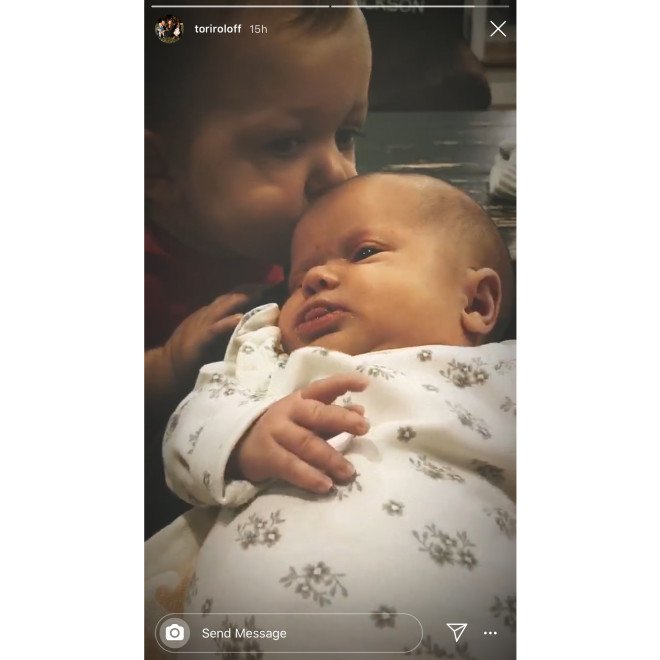 A photo of Jackson kissing his sister, Lilah Ray on her forehead | Photo: Instagram/@Tori Roloff