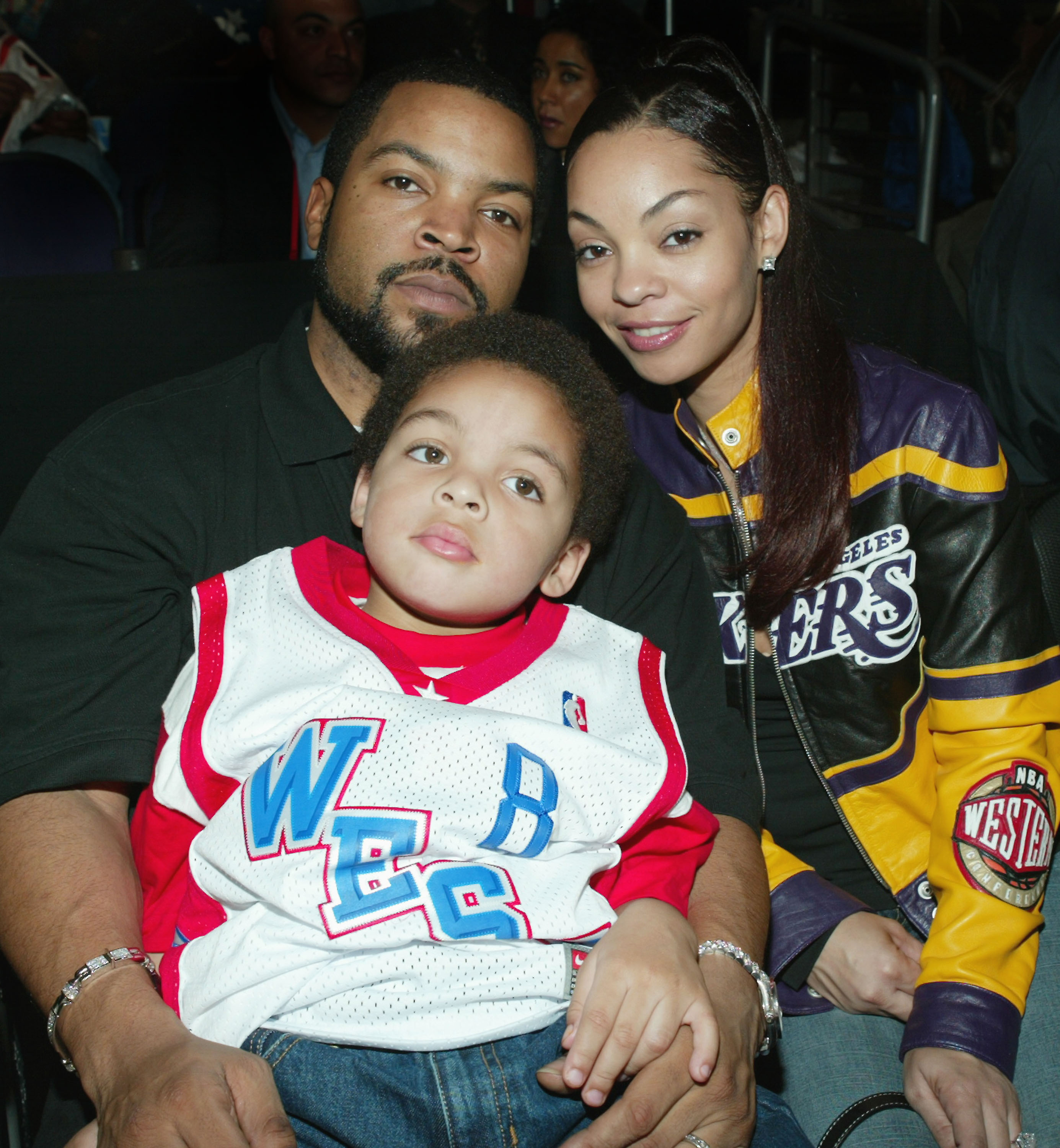 Ice Cube and Kimberly Woodruff with one of their sons at the NBA All-Star Game in Los Angeles, California on February 15, 2004. | Source: Getty Images