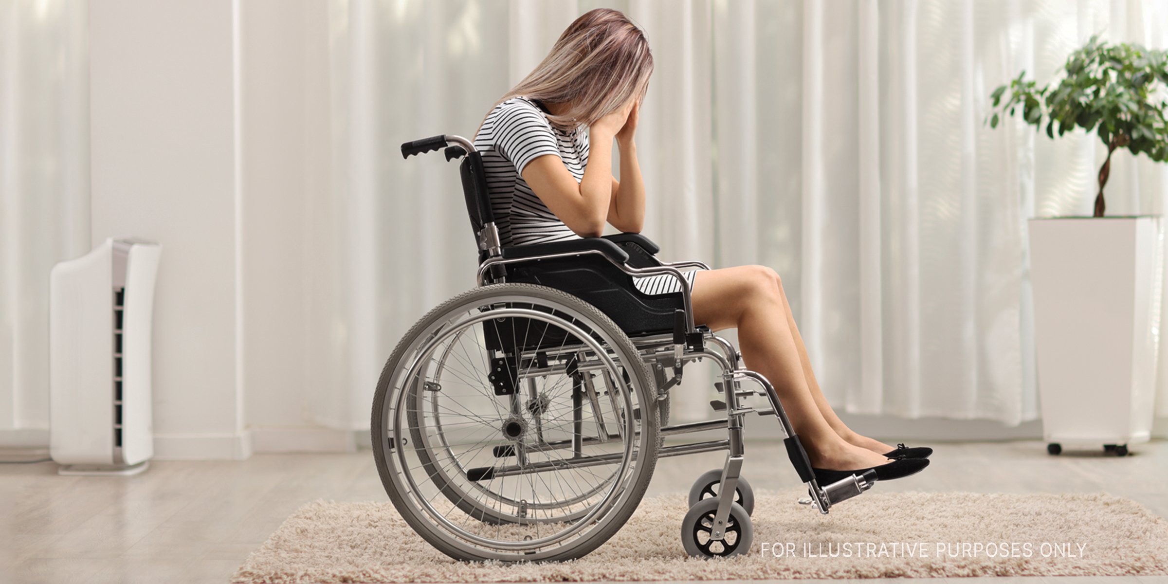 Woman crying on a wheelchair. | Source: Getty Images
