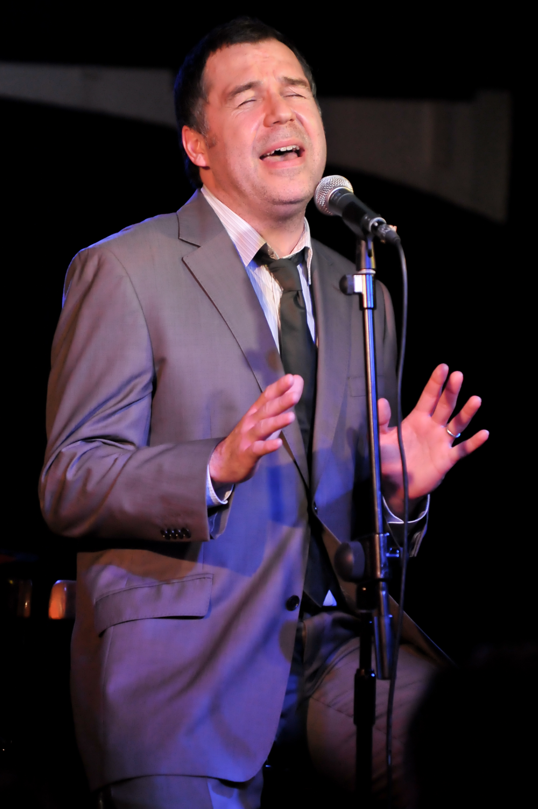 Eyes closed and arms outstretched, Brookstein pours himself into a performance at Pizza Express Jazz Club in Soho, London, in January 2010, dressed in a grey suit and dark tie as he delivers a soulful set at the intimate Soho venue.