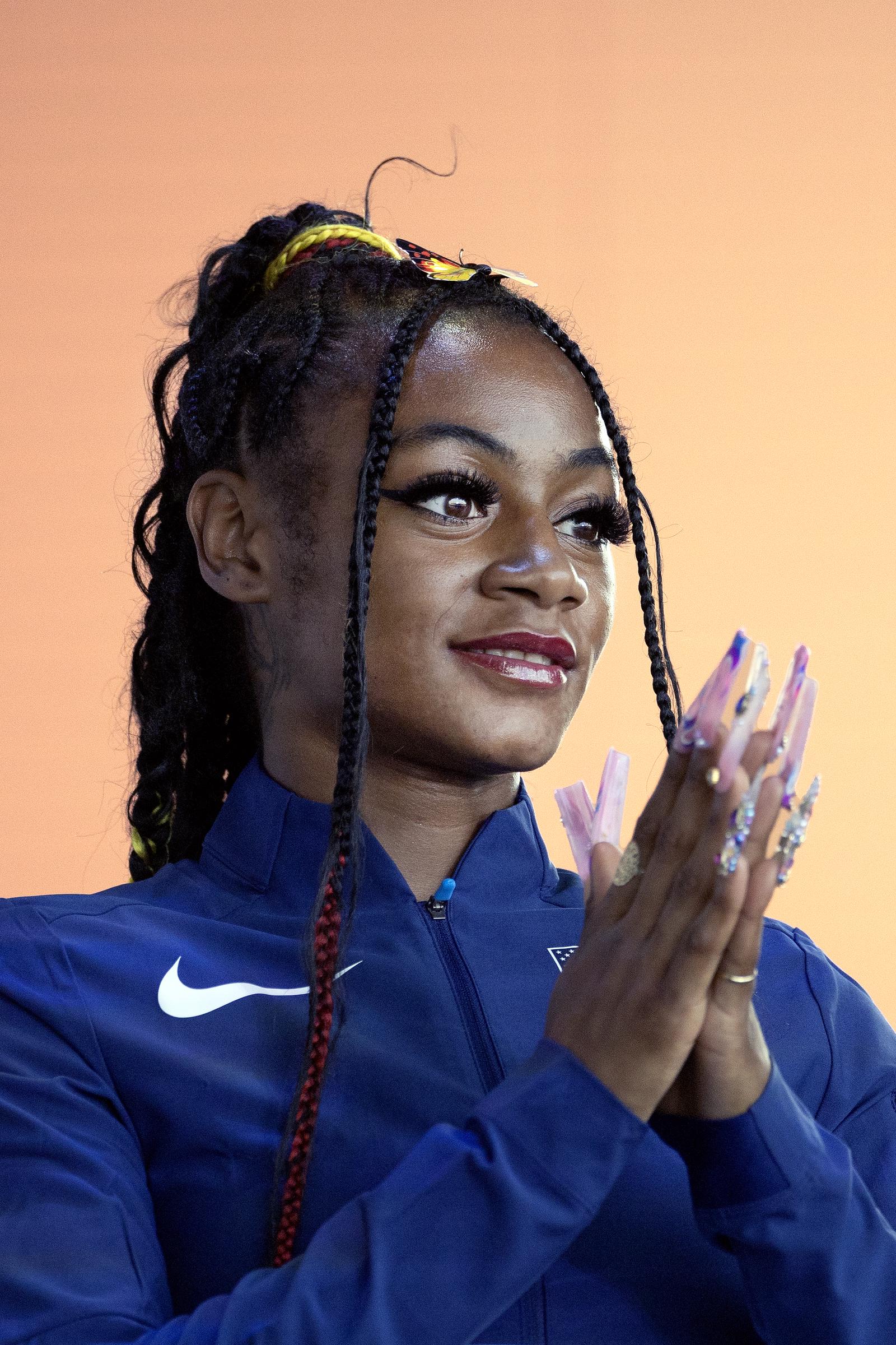 Sha'Carri Richardson on the podium to receive her bronze medal for he Women's 200-meter Final during the medal ceremony of the World Athletics Championships on August 26, 2023, in Budapest, Hungary. | Source: Getty Images