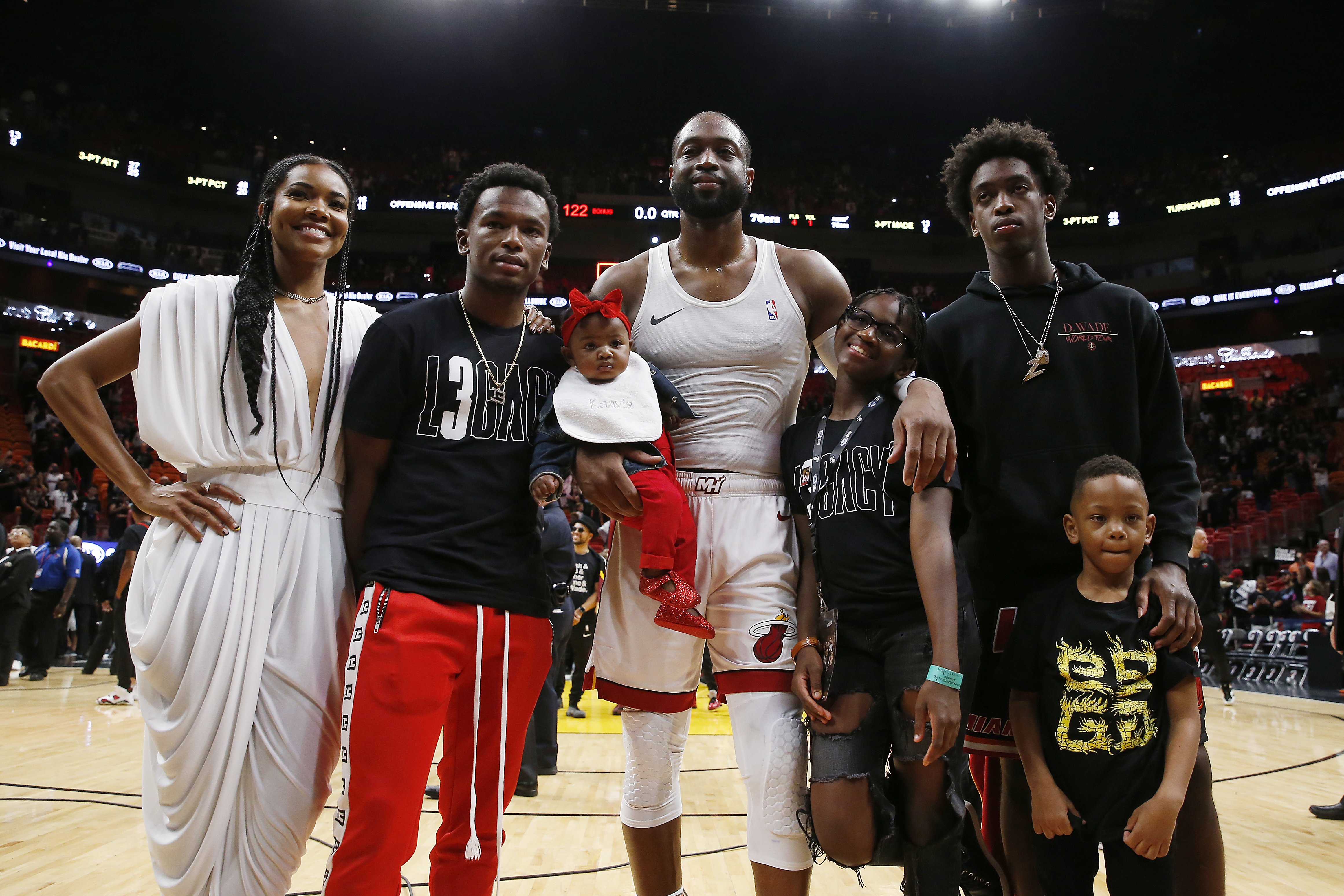 Dwyane Wade with his wife, Gabrielle Union, nephew, Dahveon Morris, and children, Kaavia James Union Wade, Zaire Wade, Xavier Wade and Zion Wade after his final career home game at American Airlines Arena on April 09, 2019 in Miami, Florida. | Source: Getty Images