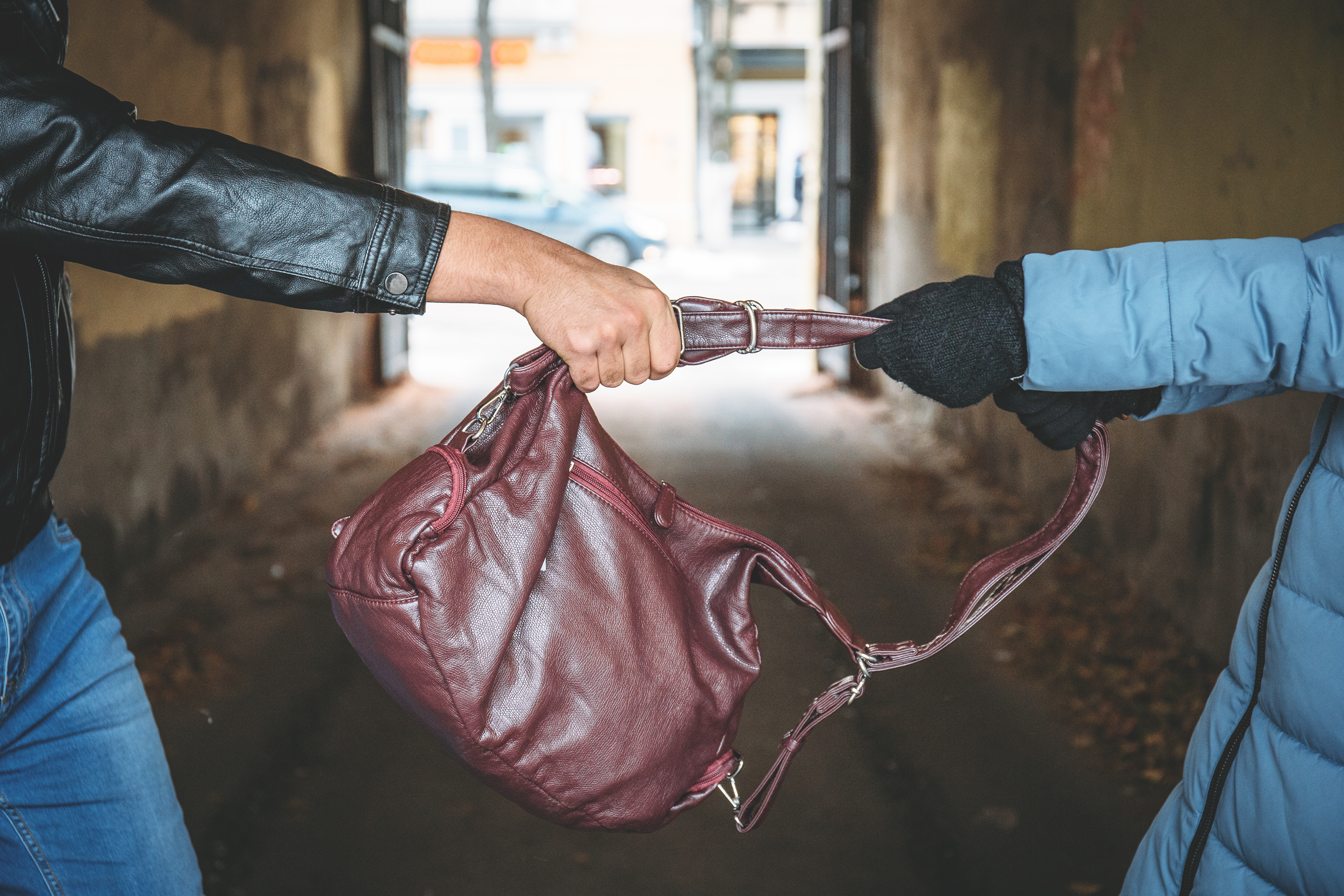 Robber snatching bag | Source: Shutterstock