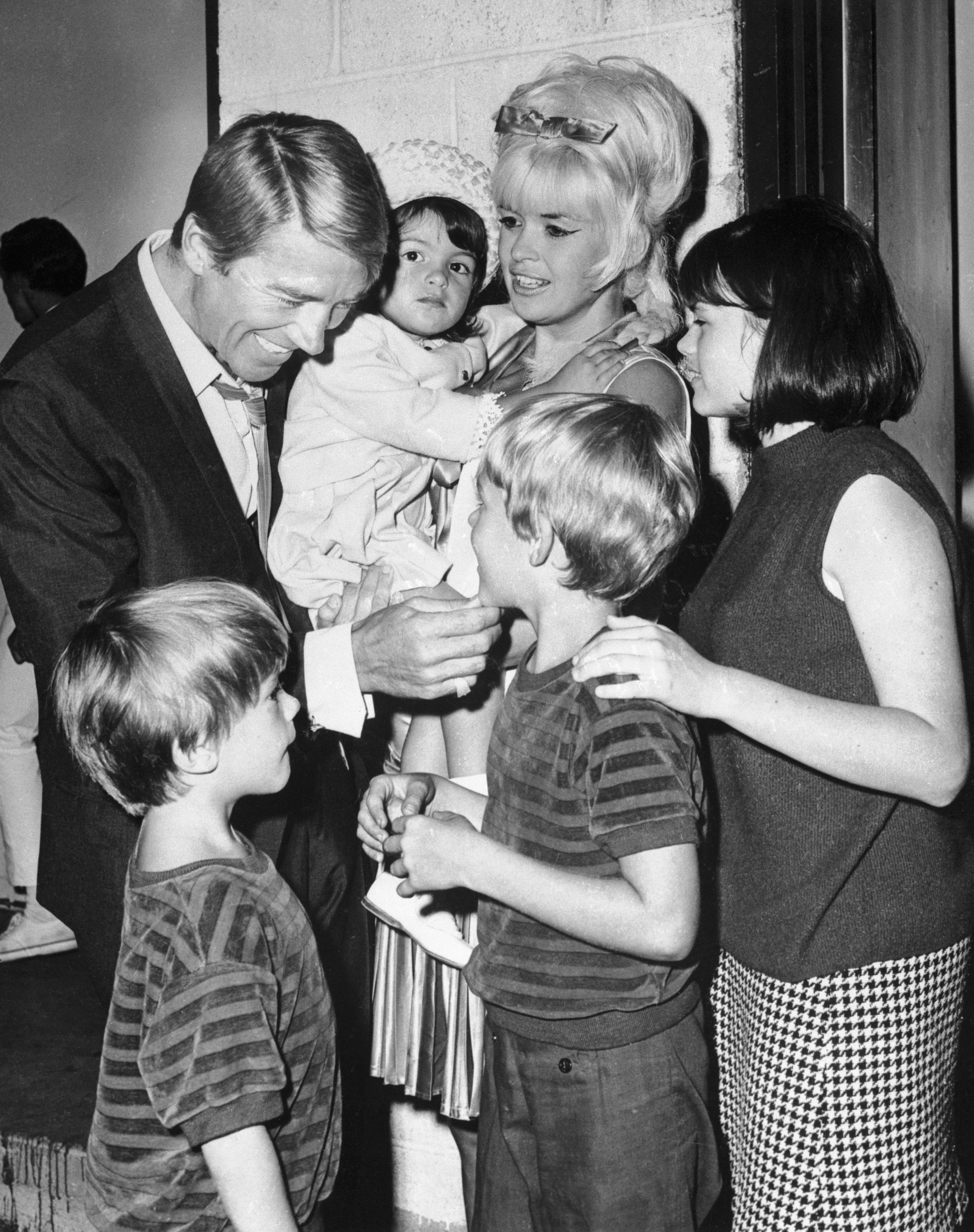 Mickey Hargitay, with his former wife Jayne Mansfield, and their children Zoltan, 5, Mikos, 7, and Mariska 2, and Jayne Maria, 14, on July 19, 1966, backstage at the Westbury, L. I. Music Fair | Source: Getty Images
