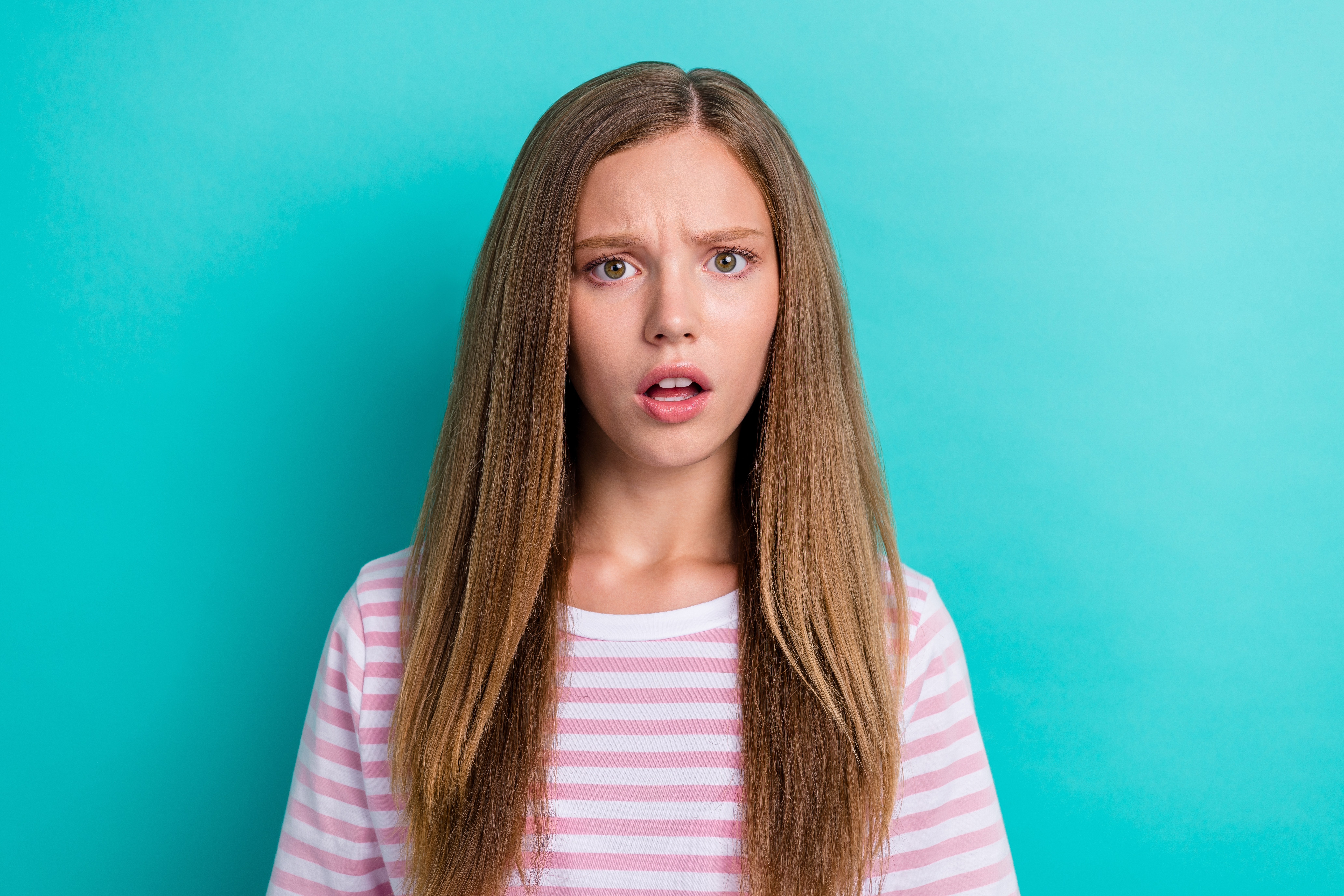 A surprised young girl | Source: Shutterstock