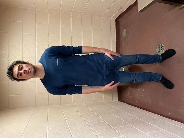 Luigi Mangione stands in a holding cell in Altoona, Pennsylvania, after his arrest on December 9, 2024 | Source: Getty Images