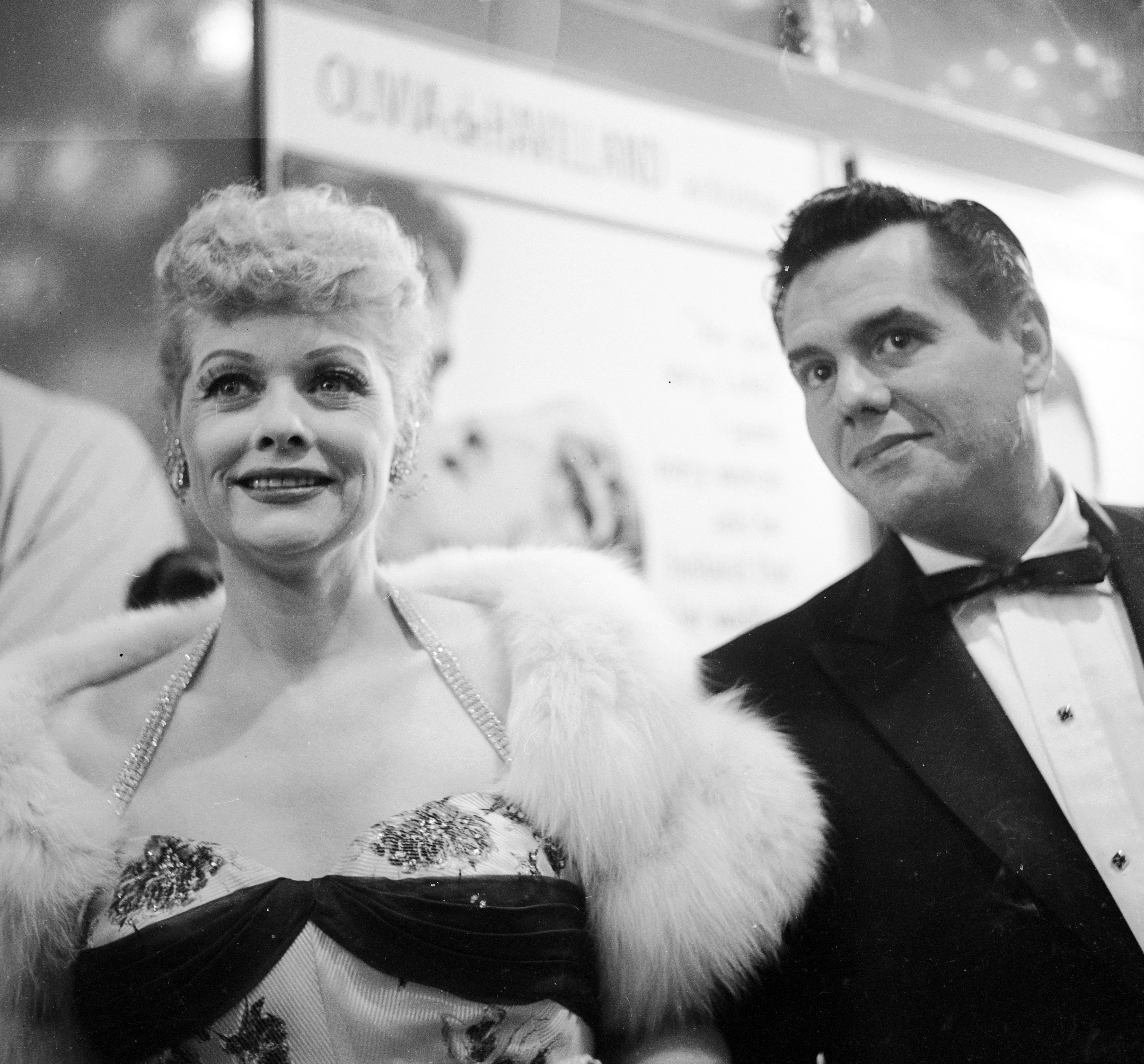American actress Lucille Ball and her husband Desi Arnaz  arrive at a CBS party in honor of Johnny Carson, 30th June 1955 | Source: Getty Images
